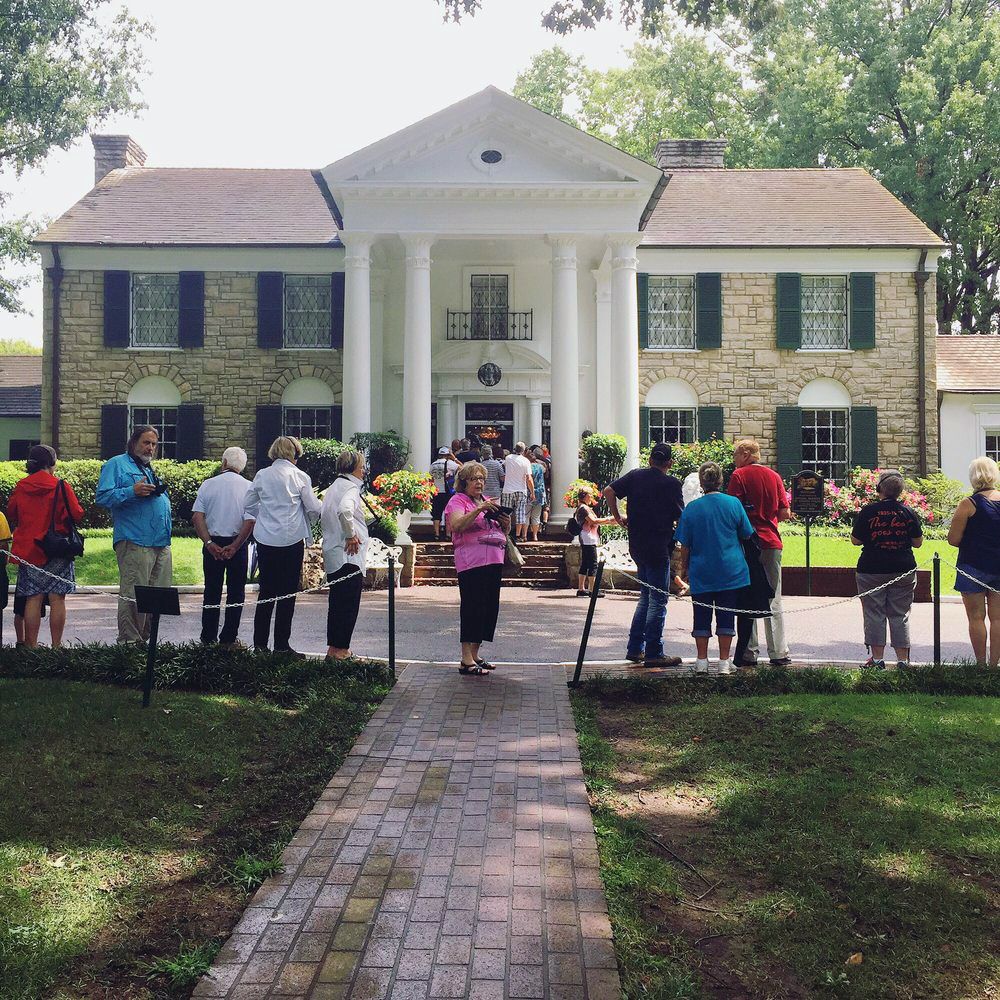 people outside of the front door of main Graceland house