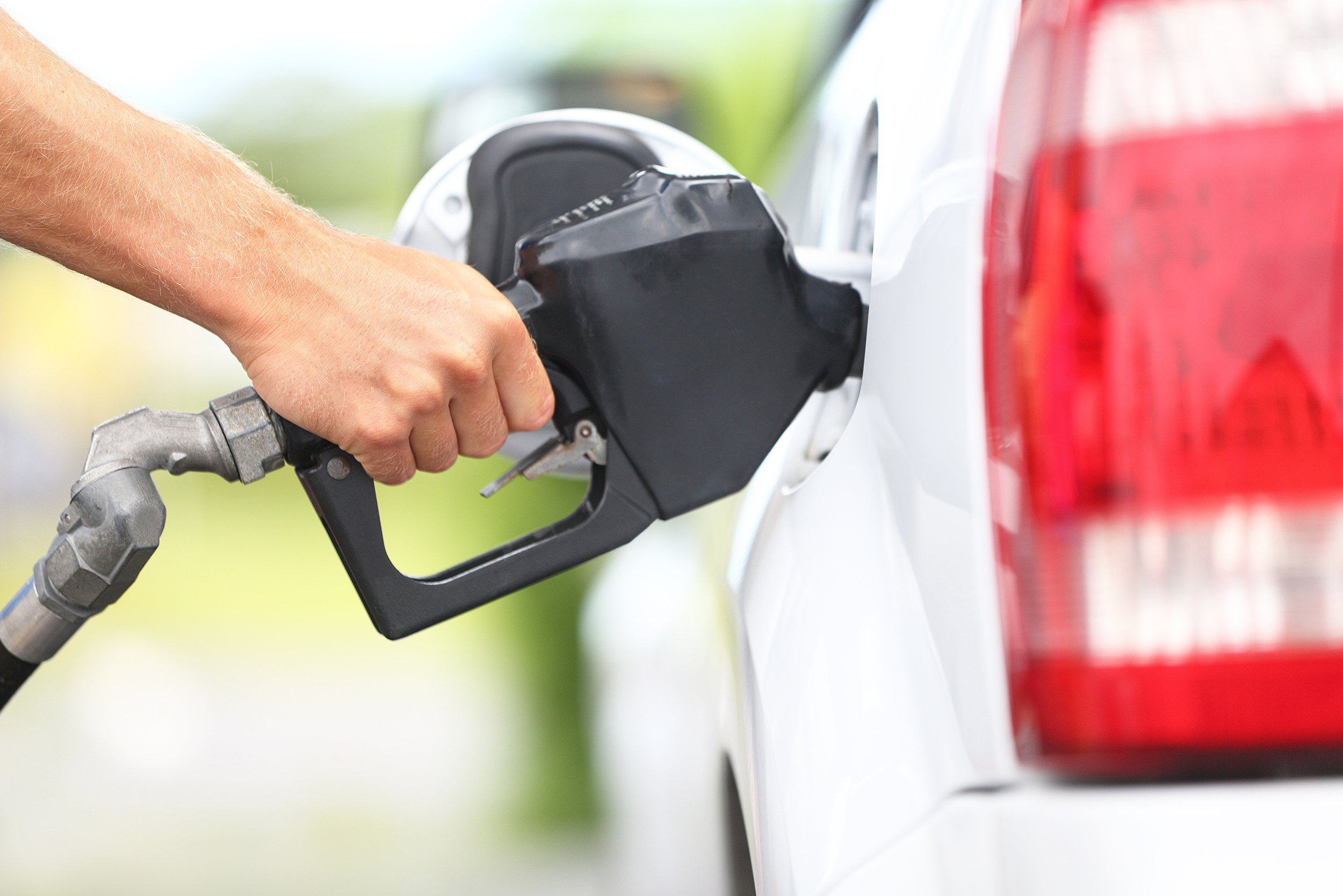 pumping gas at gas pump