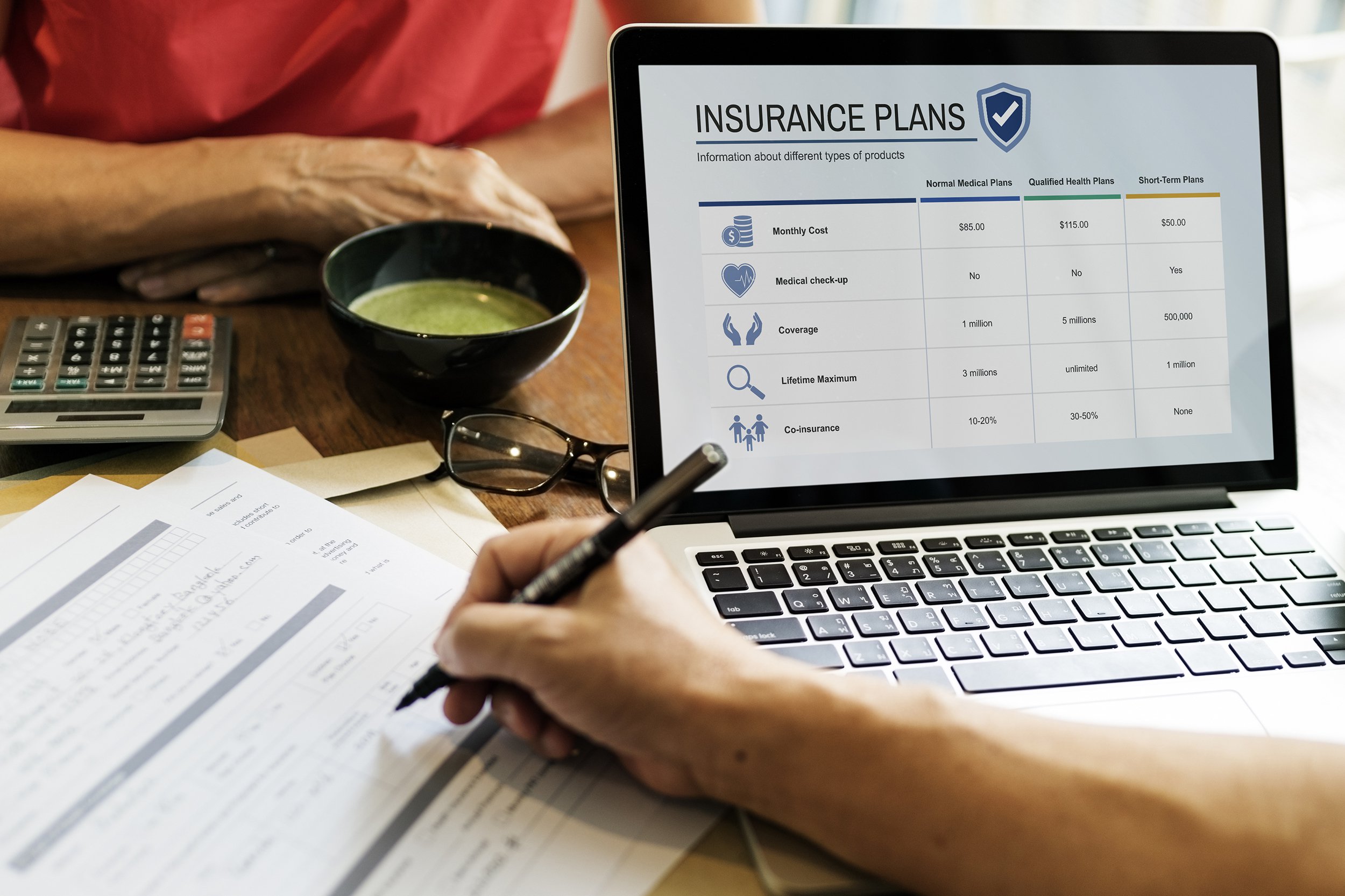 Man looking at insurance information on computer