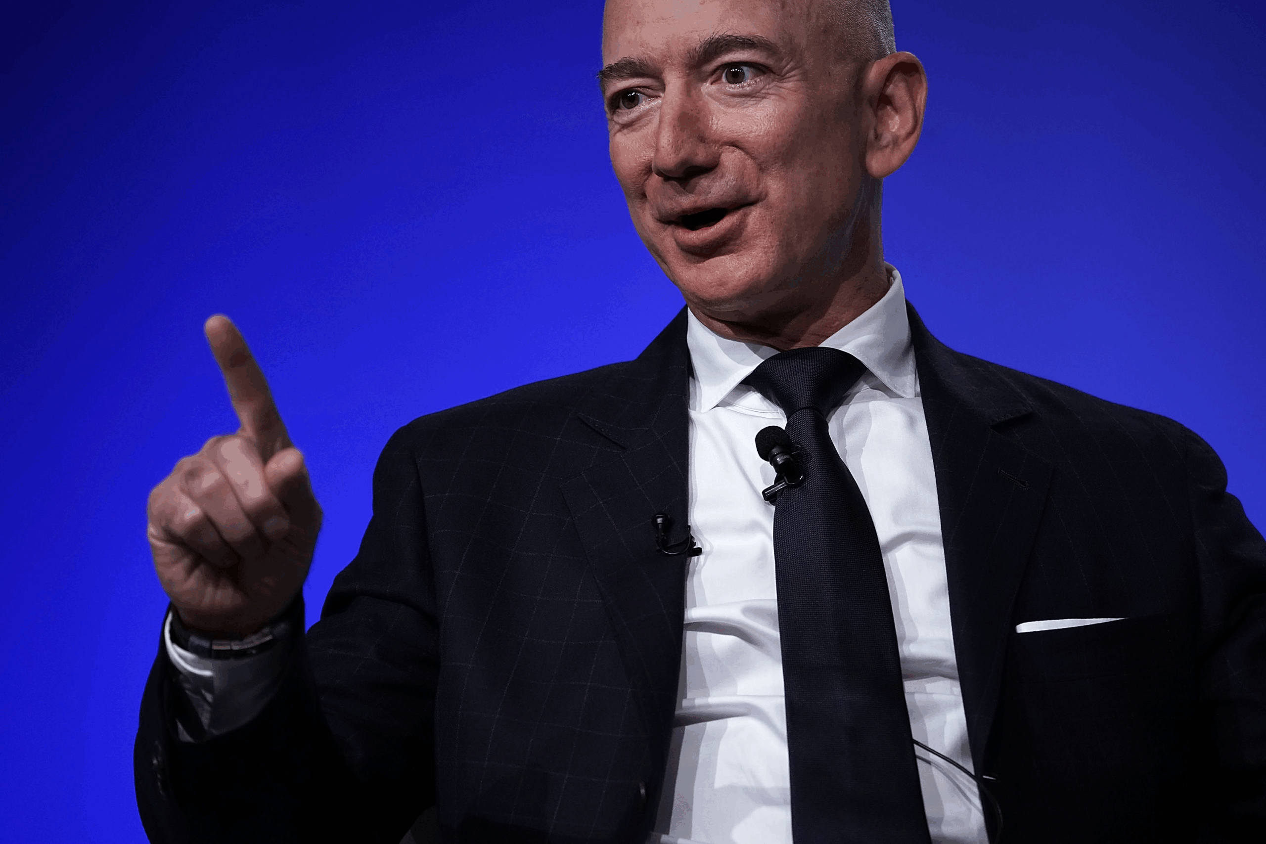 Closeup of Jeff Bezos as he speaks at the Air Force Association Air, Space, and Cyber Conference, National Harbor, Maryland, 2018, vivid blue background