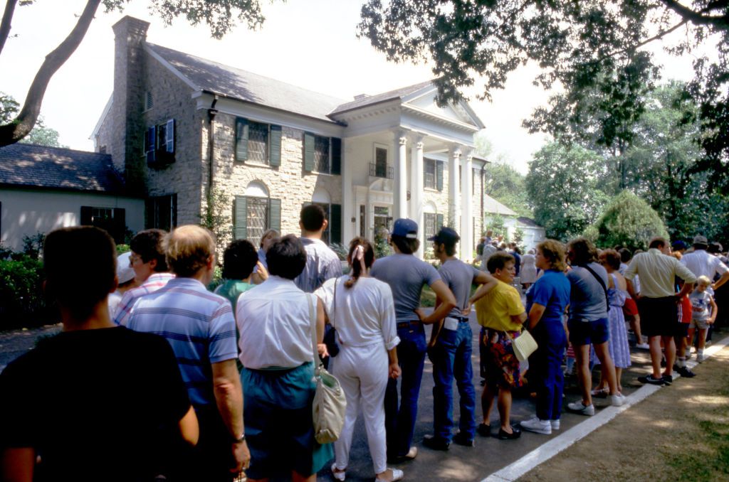 Fans line up to pay their respects, leave gifts, flowers and decorations at the gravesite of Elvis Presley prior to the 10th Anniversary of his death on August 11, 1987 at Graceland in Memphis, Tennessee.