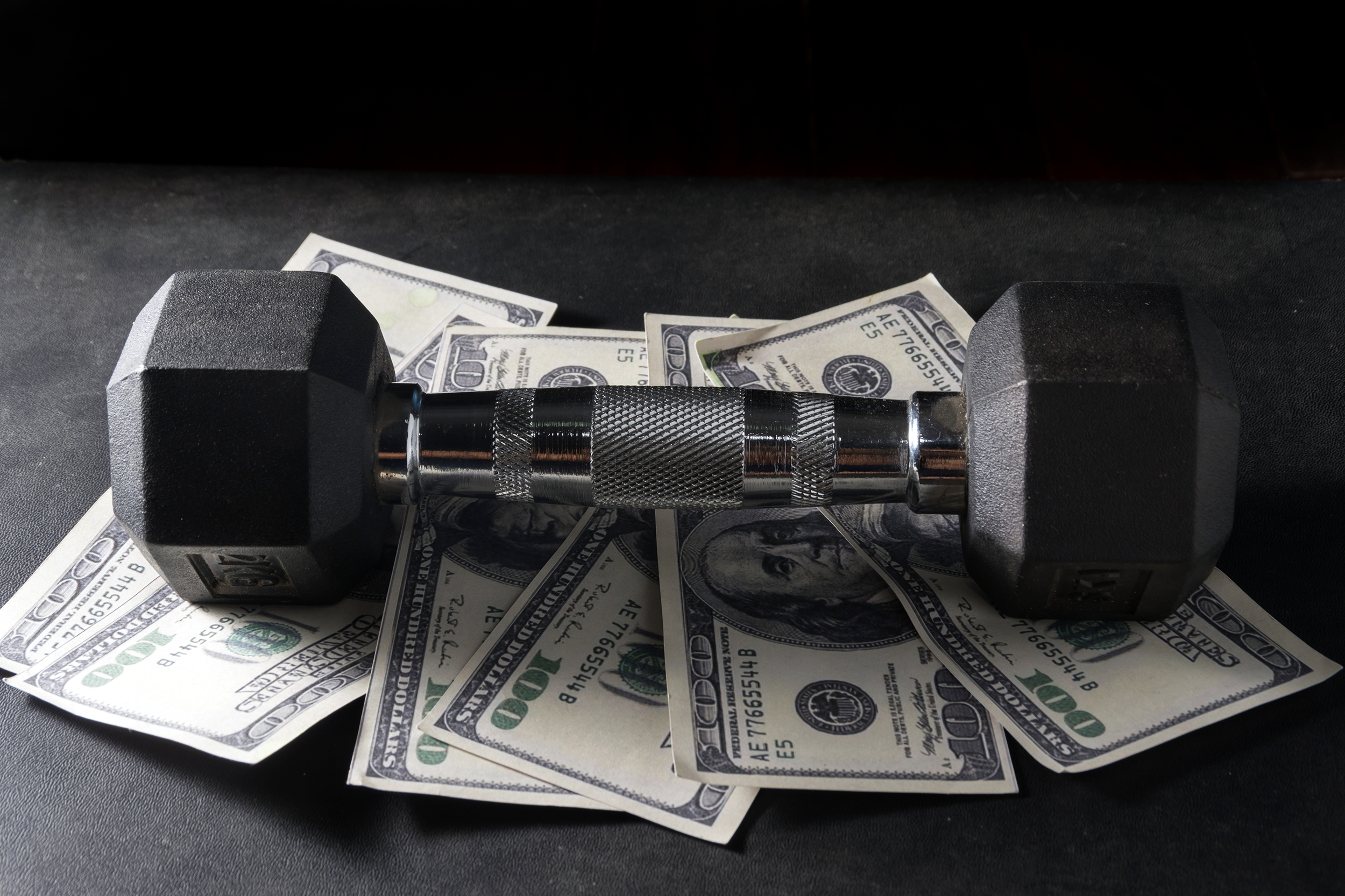 Dumbbell on dollar bills