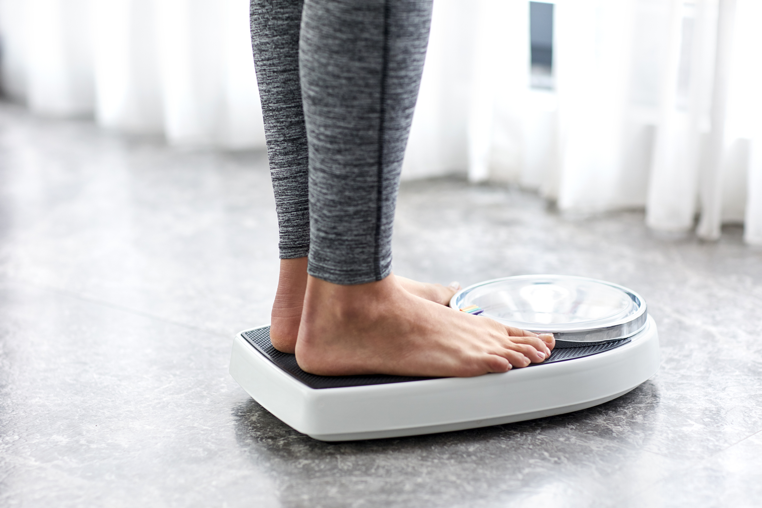 Woman standing on a scale