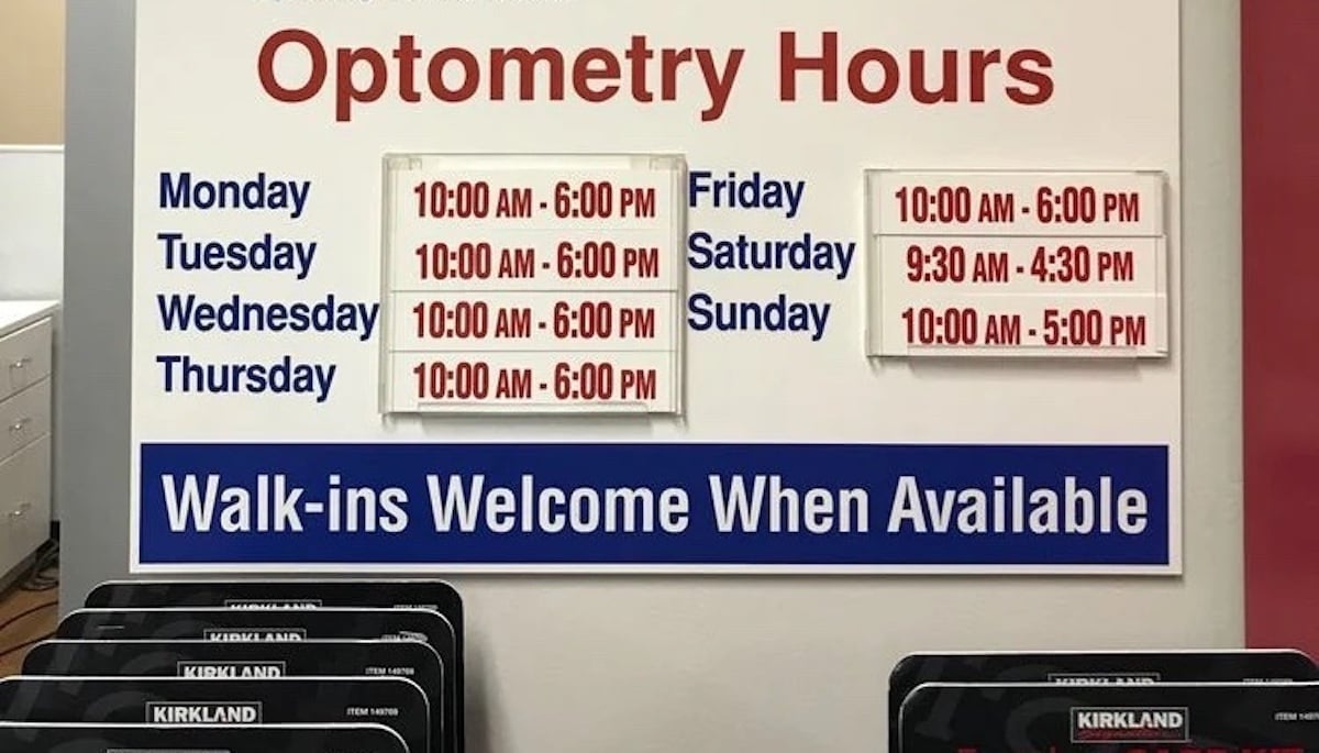 A sign displays Costco Optical hours: Mon-Thurs 10:00 AM–6:00 PM, Fri 10:00 AM–6:00 PM, Sat 9:30 AM–4:30 PM, Sun 10:00 AM–5:00 PM. A blue banner below reads, “Walk-ins Welcome When Available.”