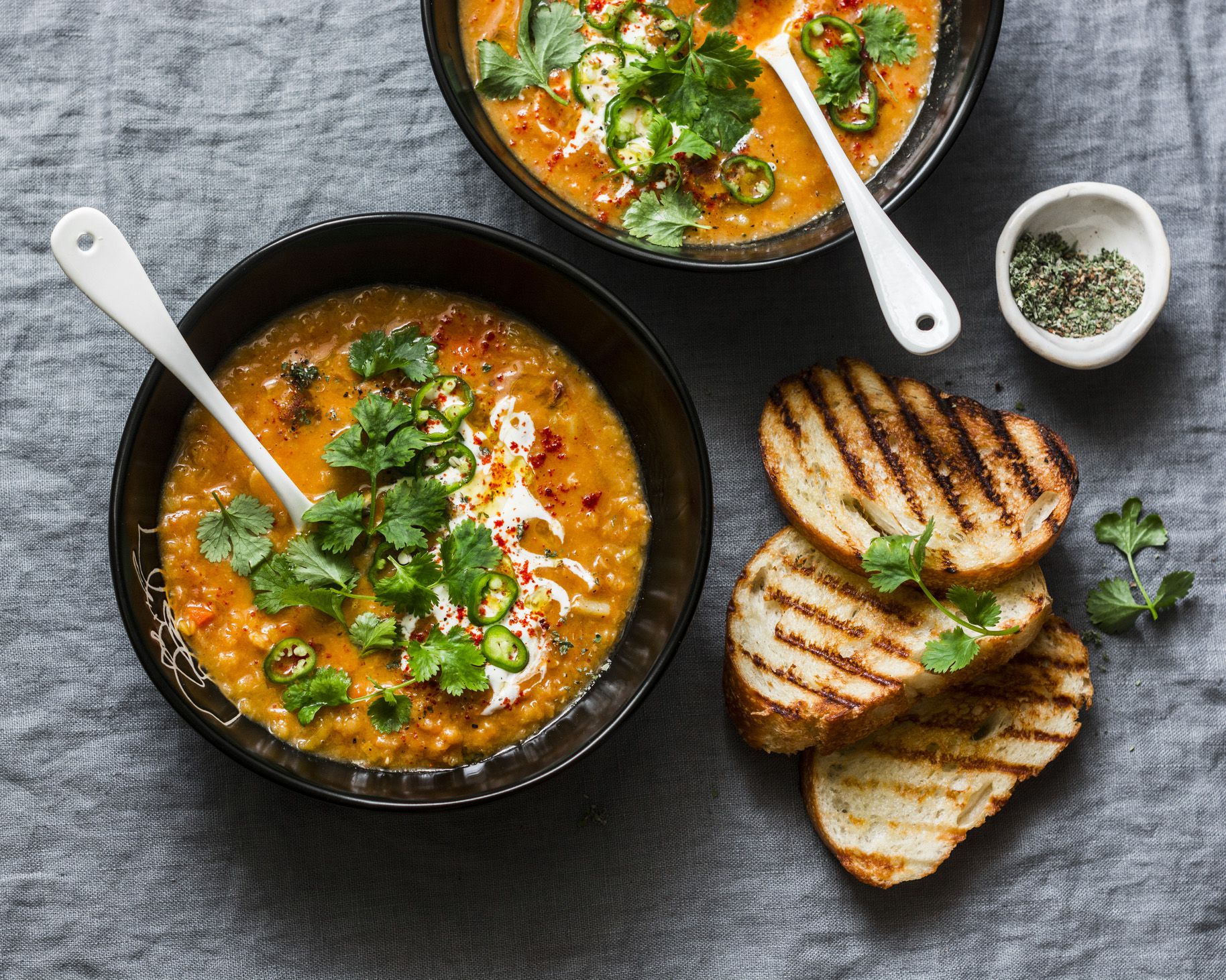 lentil soup with dash of yogurt and cilantro garnish