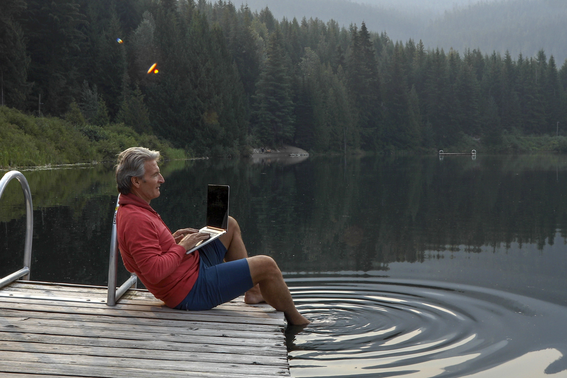 man working at a lake