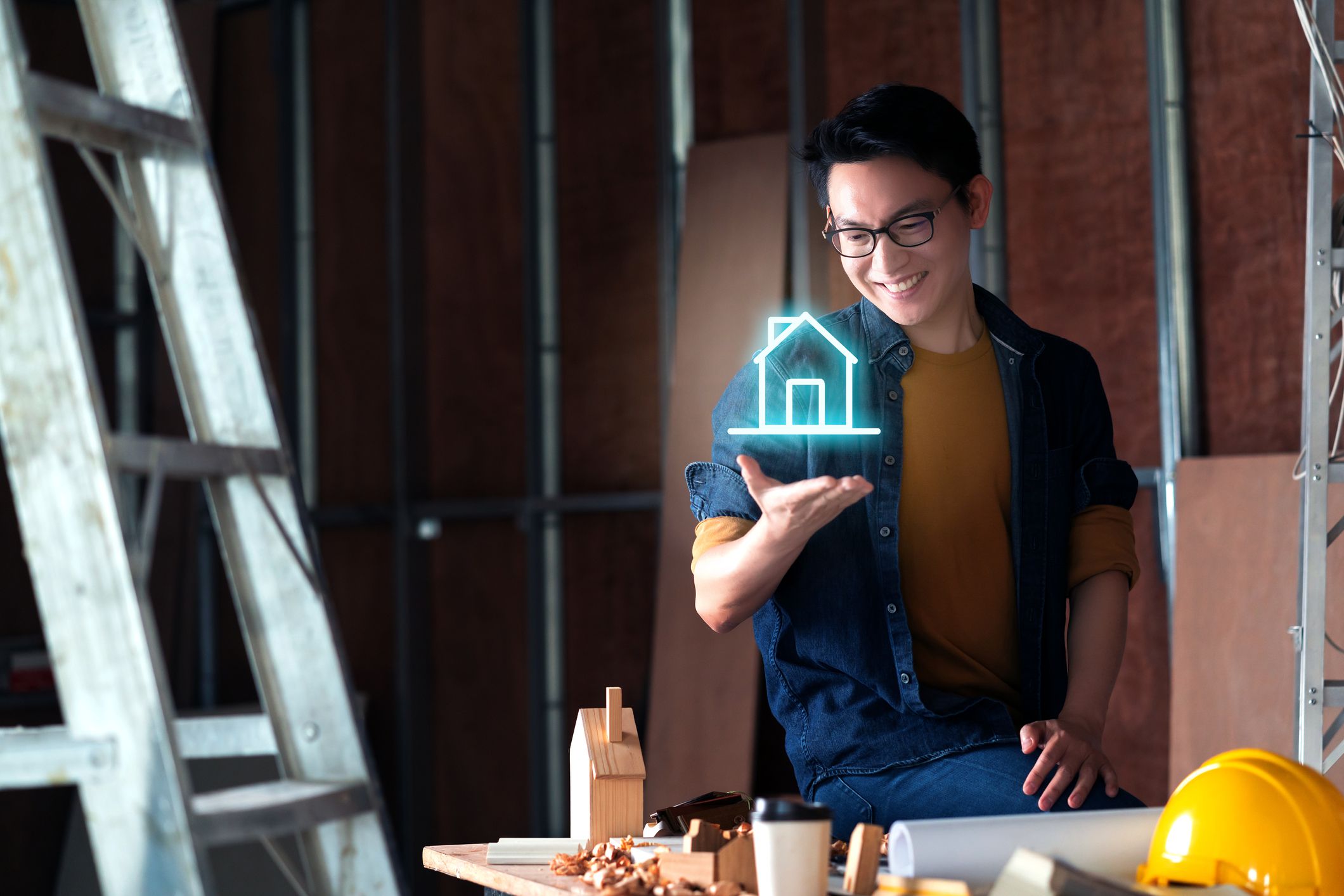asian house owner hand show digital hologram house virtual technology home improvement ideas concept
