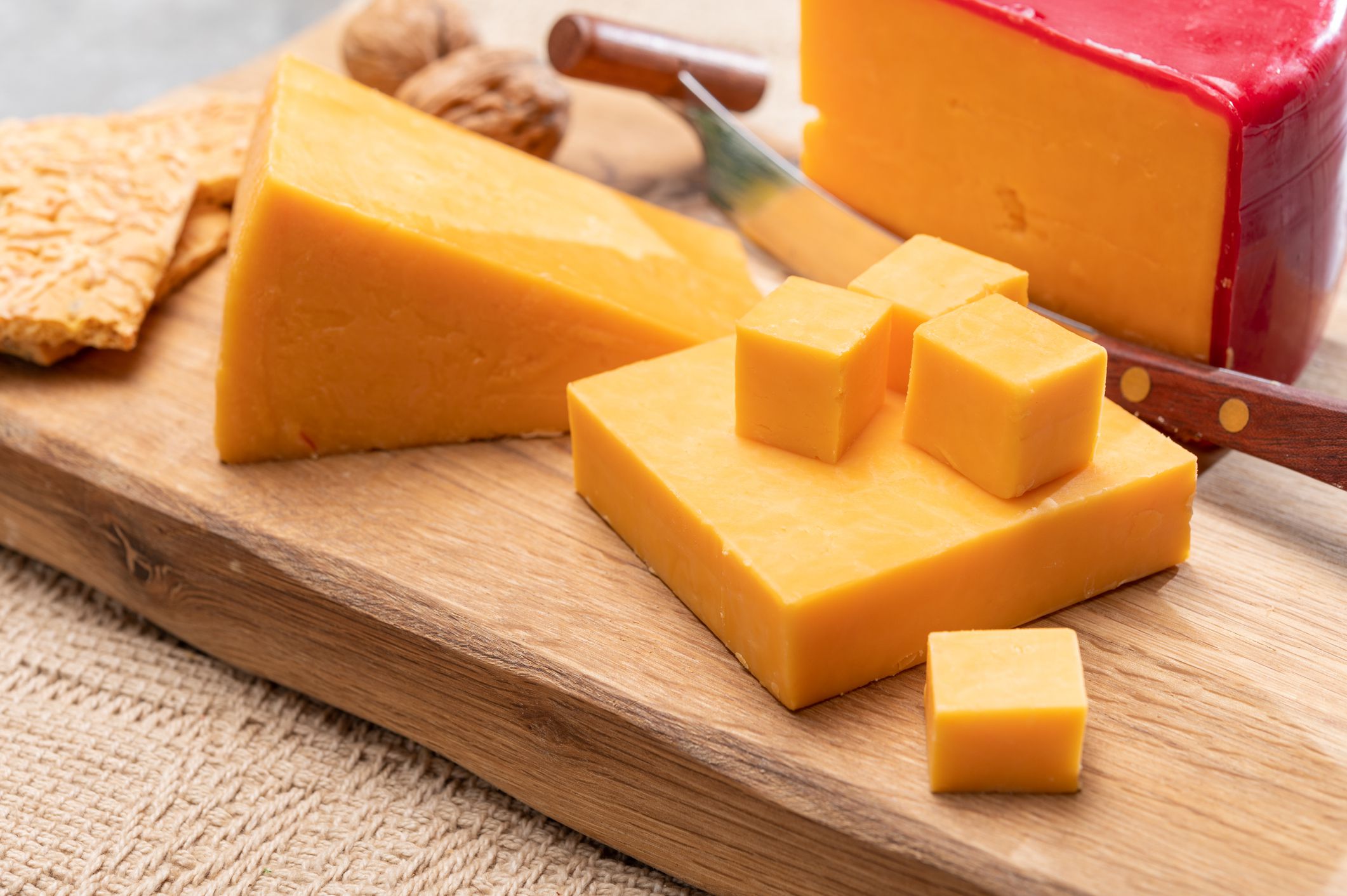 British red waxed yellow cheddar cheese close up