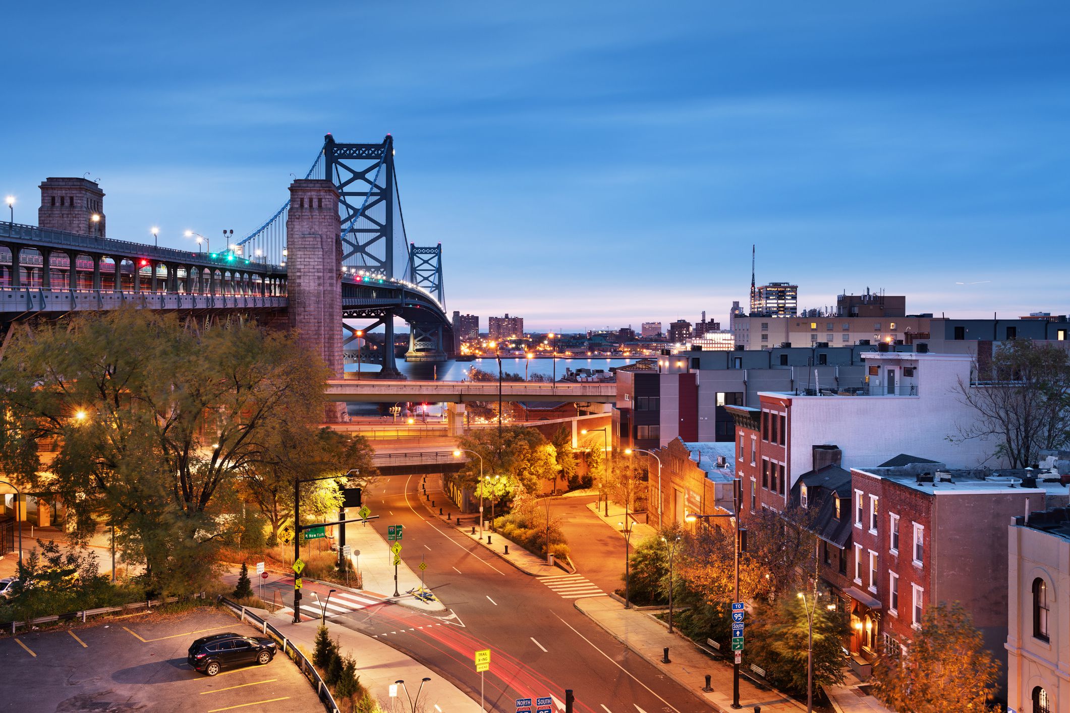 Philadelphia, Pennsylvania, USA at Benjamin Franklin Bridge spanning the Delaware River towards Camden, New Jersey.