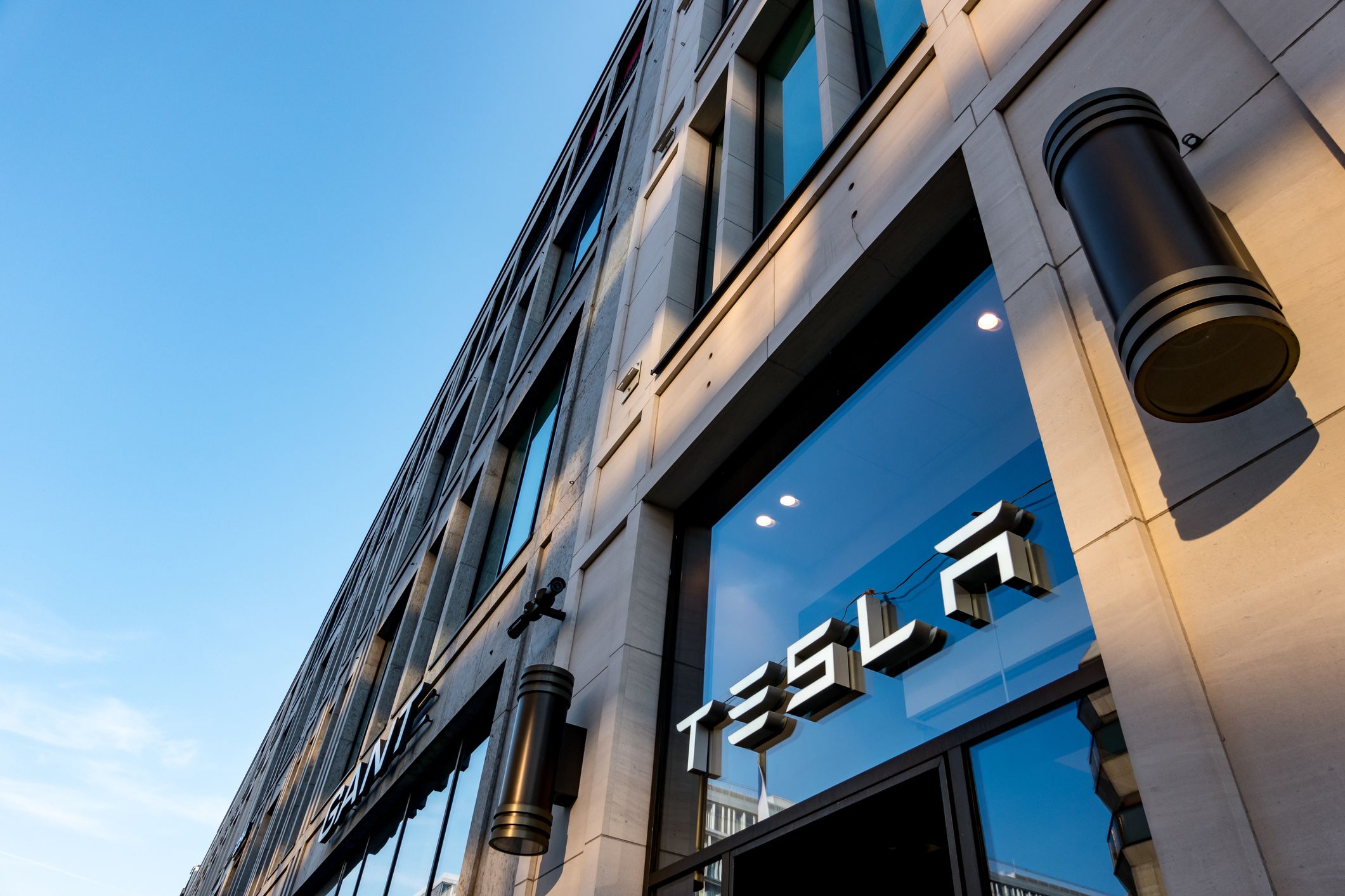 Entrance of a Tesla vehicles shop in central Berlin, Germany. No people.