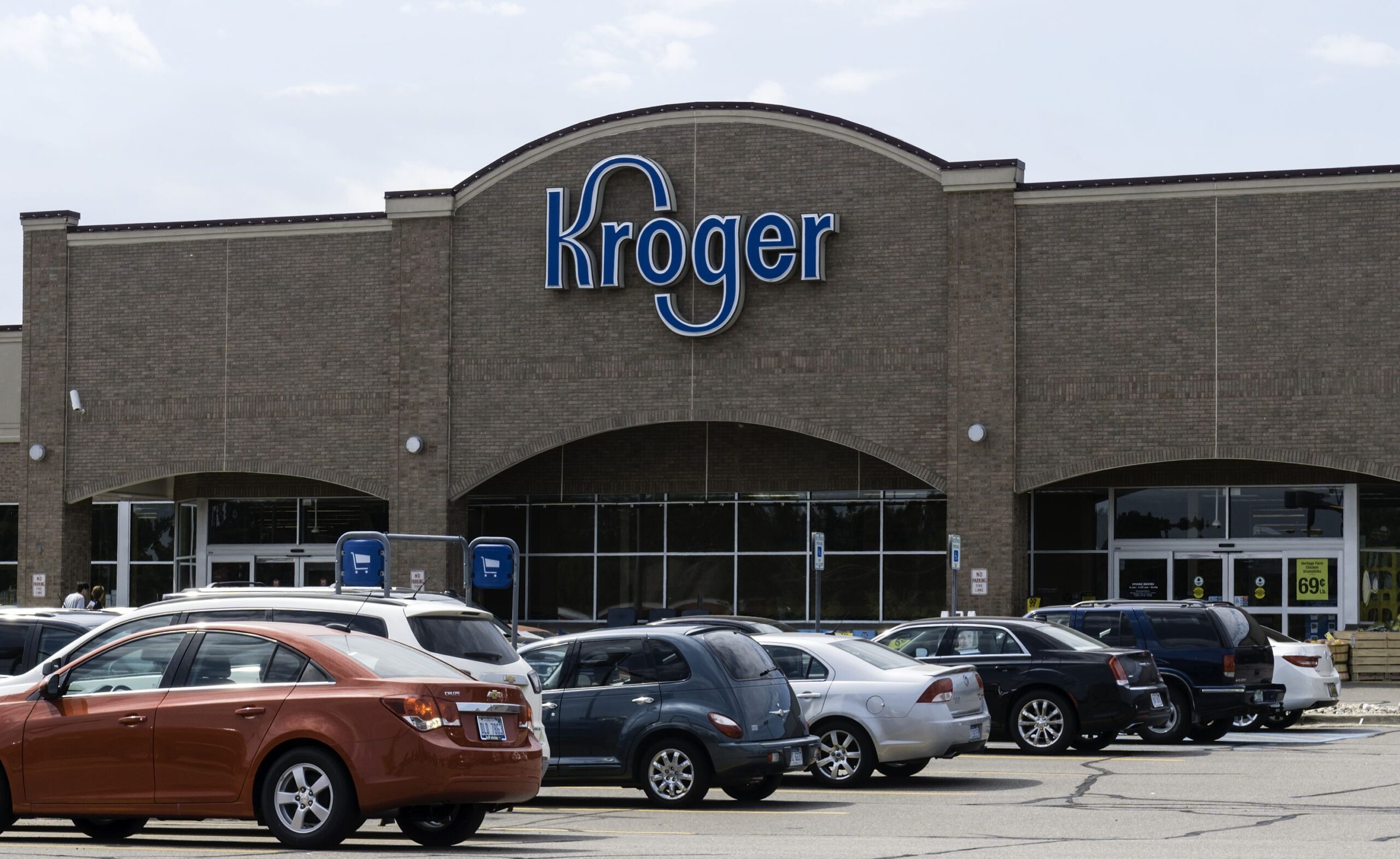 Shelby Township, Michigan, USA - June 23, 2016: People entering the Kroger store on Dequindre Road in Shelby Township, Michigan. Kroger is a chain of grocery stores founded by Bernard Kroger in 1883 with over 3600 locations nationwide.