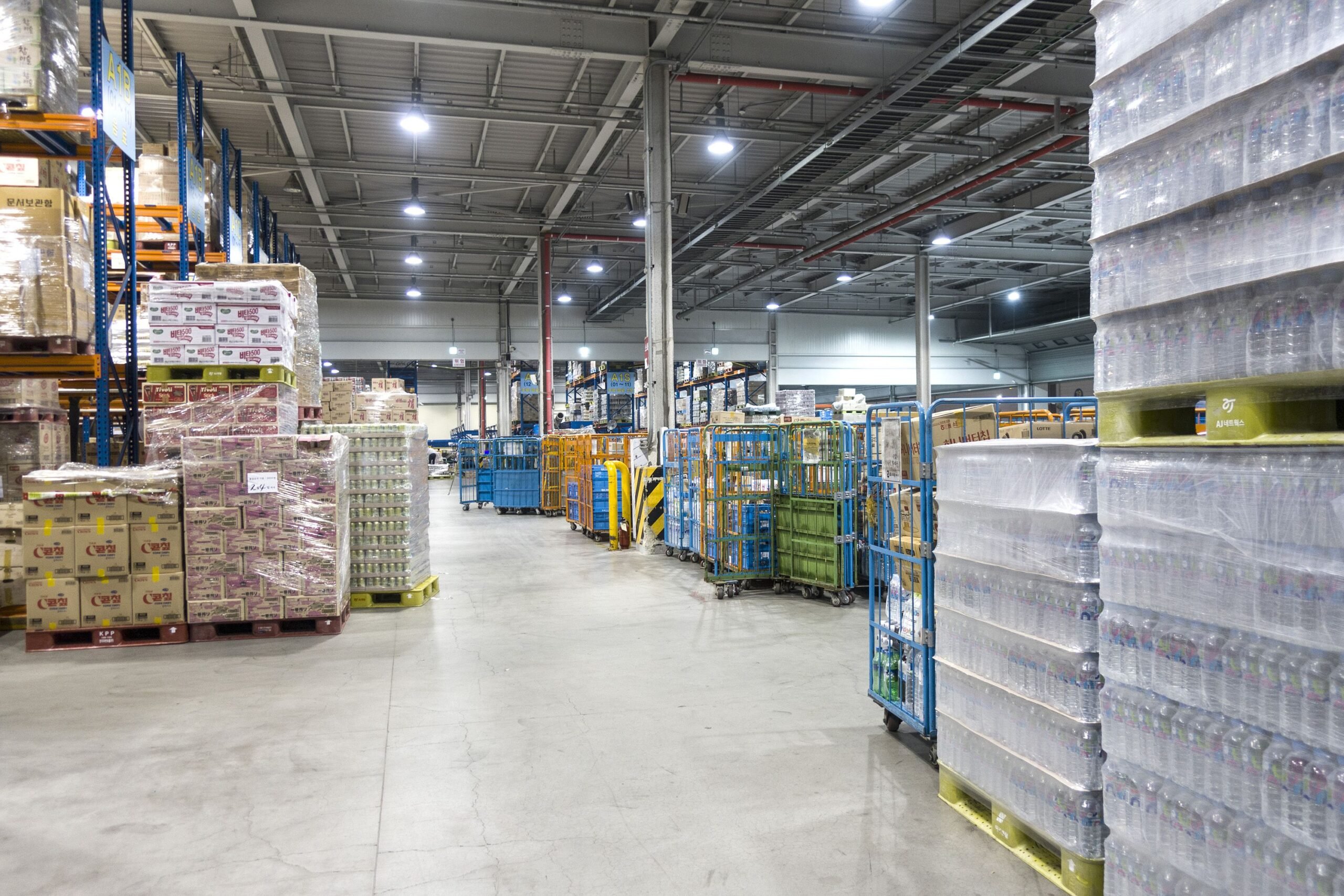 Large modern warehouse with forklifts