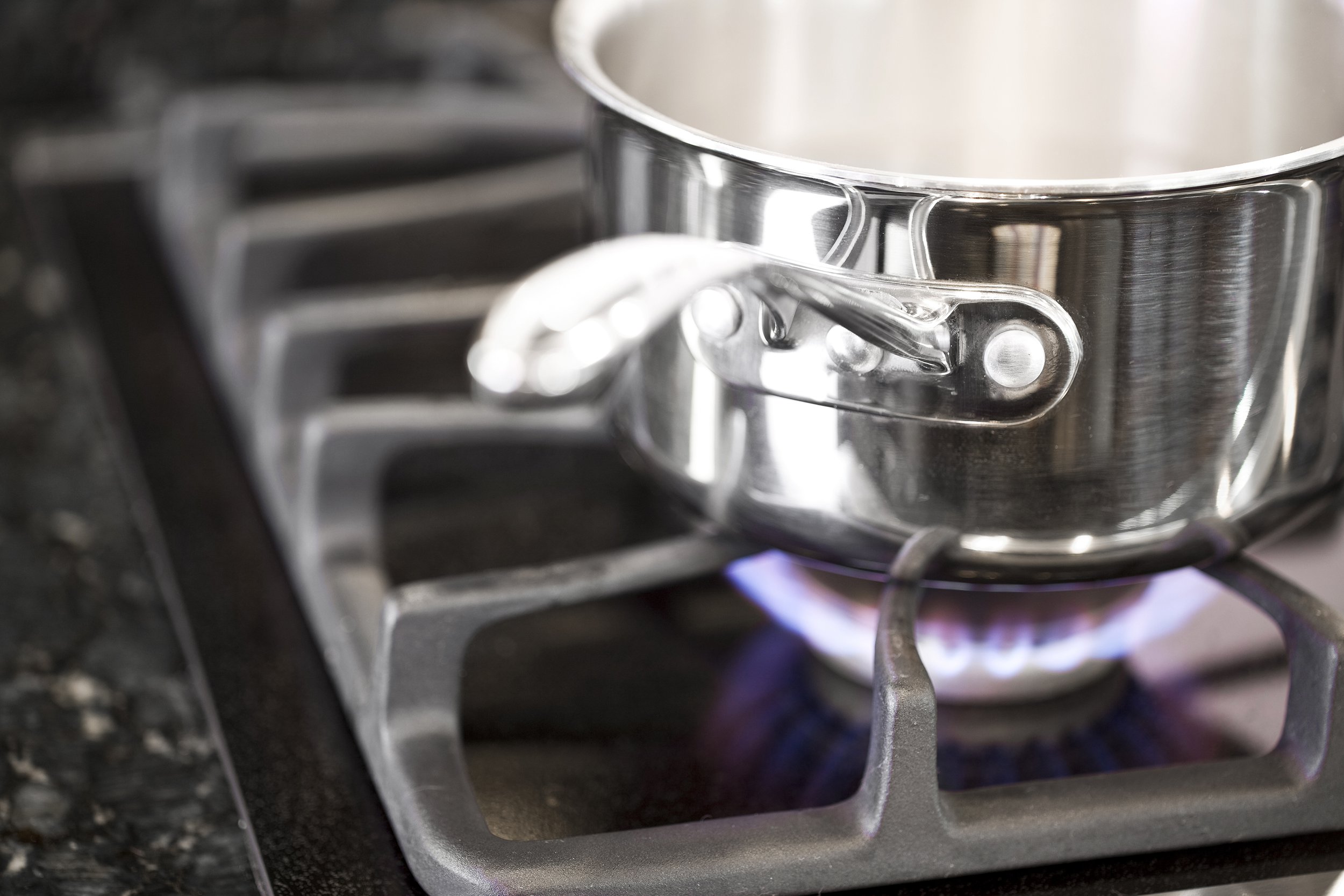 Metal-handled sauce pot on the stove