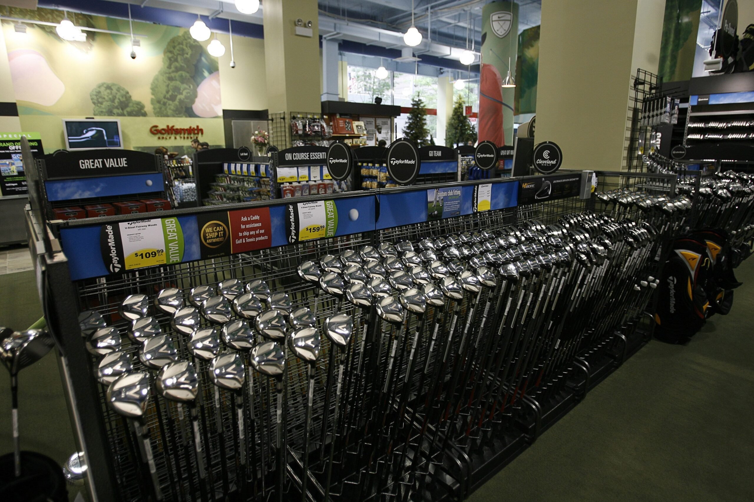 Numerous golf clubs for sale, Golfsmith Store, Manhattan, New York City with other golf accessories in the background