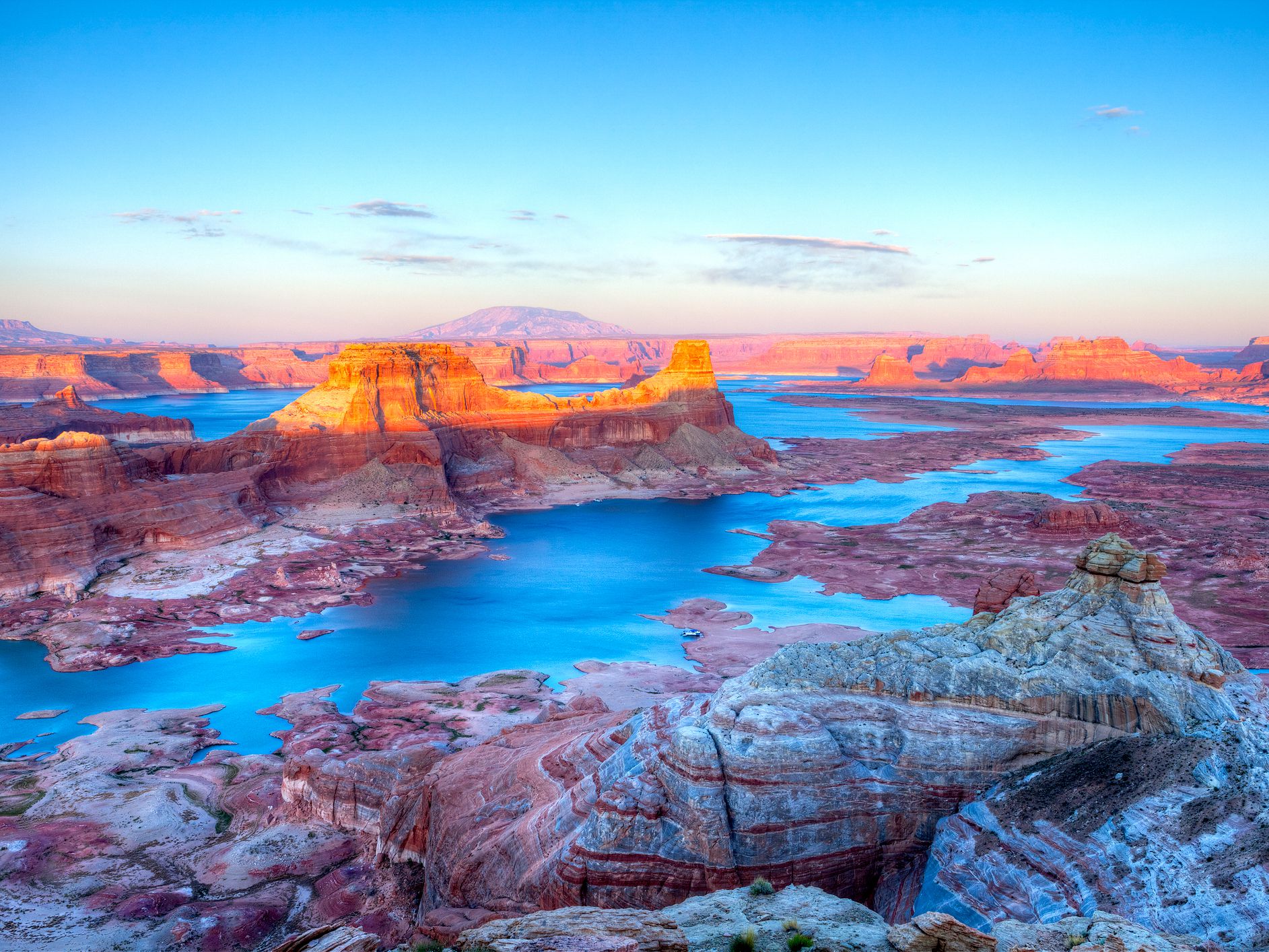Sunset lit Gun Sight Butte in Lake Powell.