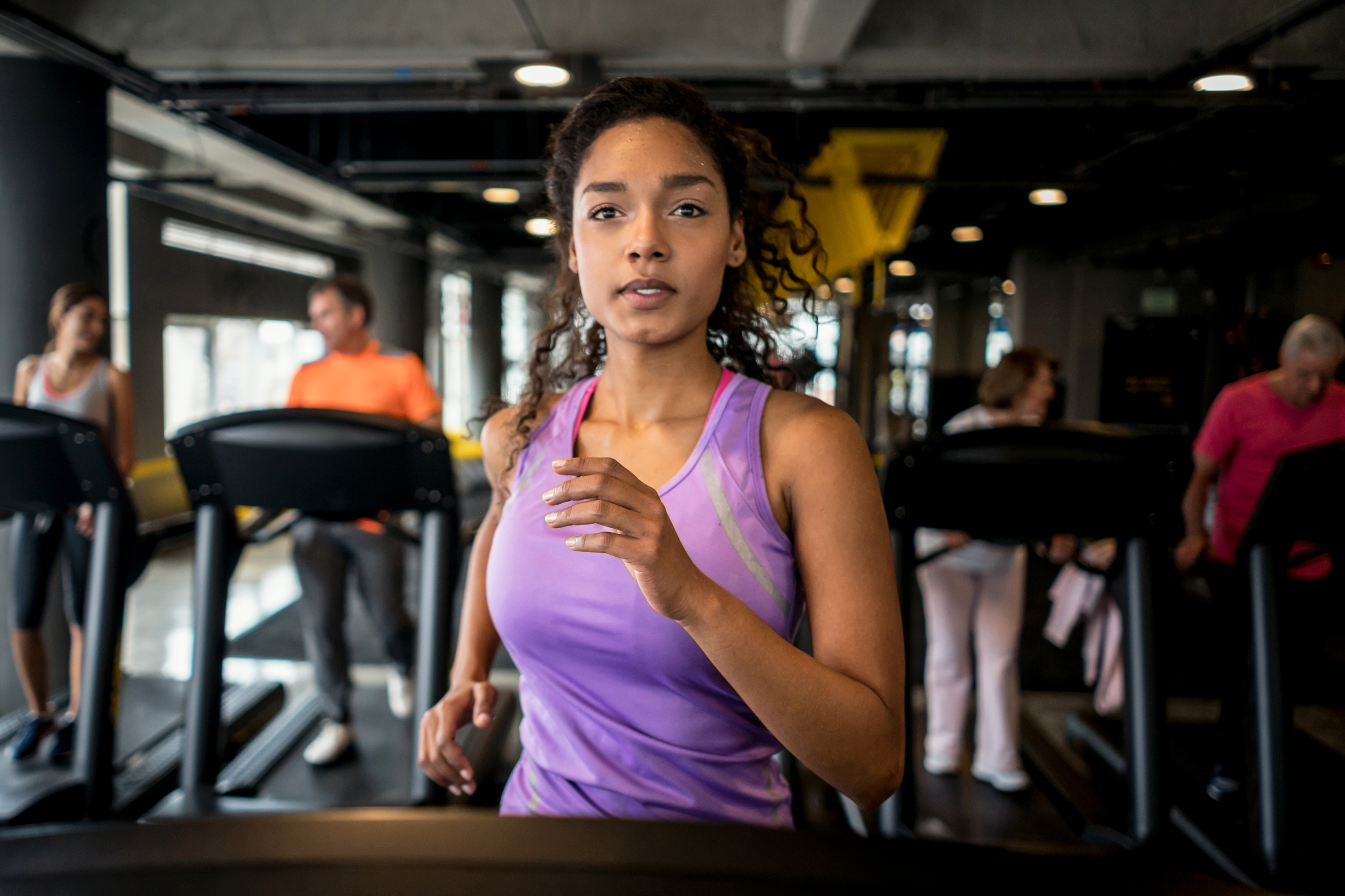 Woman running on the treadmill at the gym