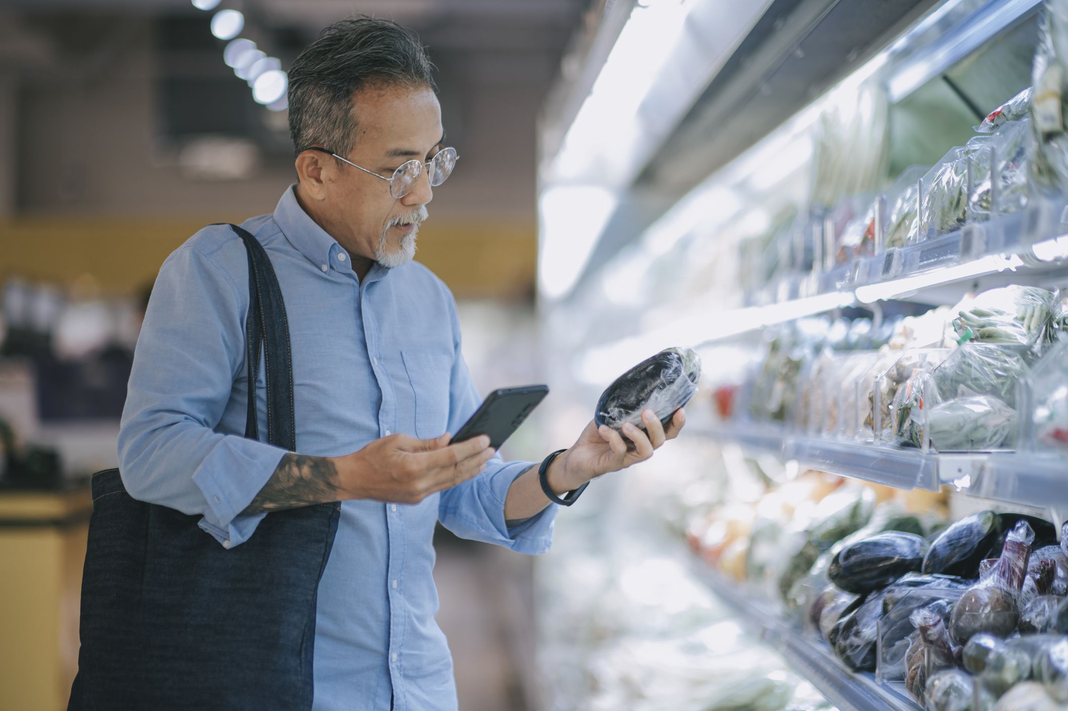 asian chinese senior man shopping in supermarket