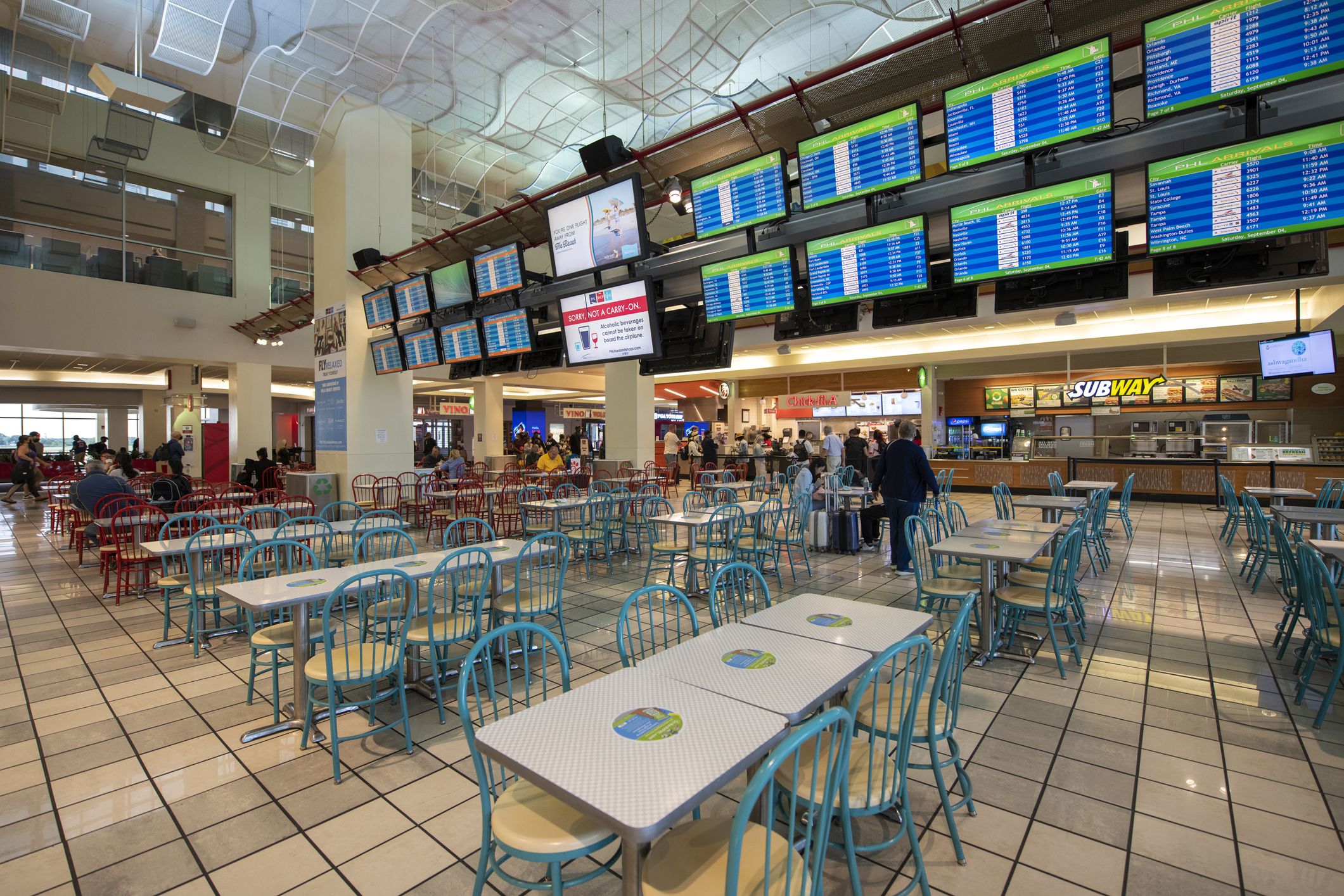 Philadelphia, USA - September 4, 2021. Travelers dining at food court inside the terminal of Philadelphia International Airport, Philadelphia, USA