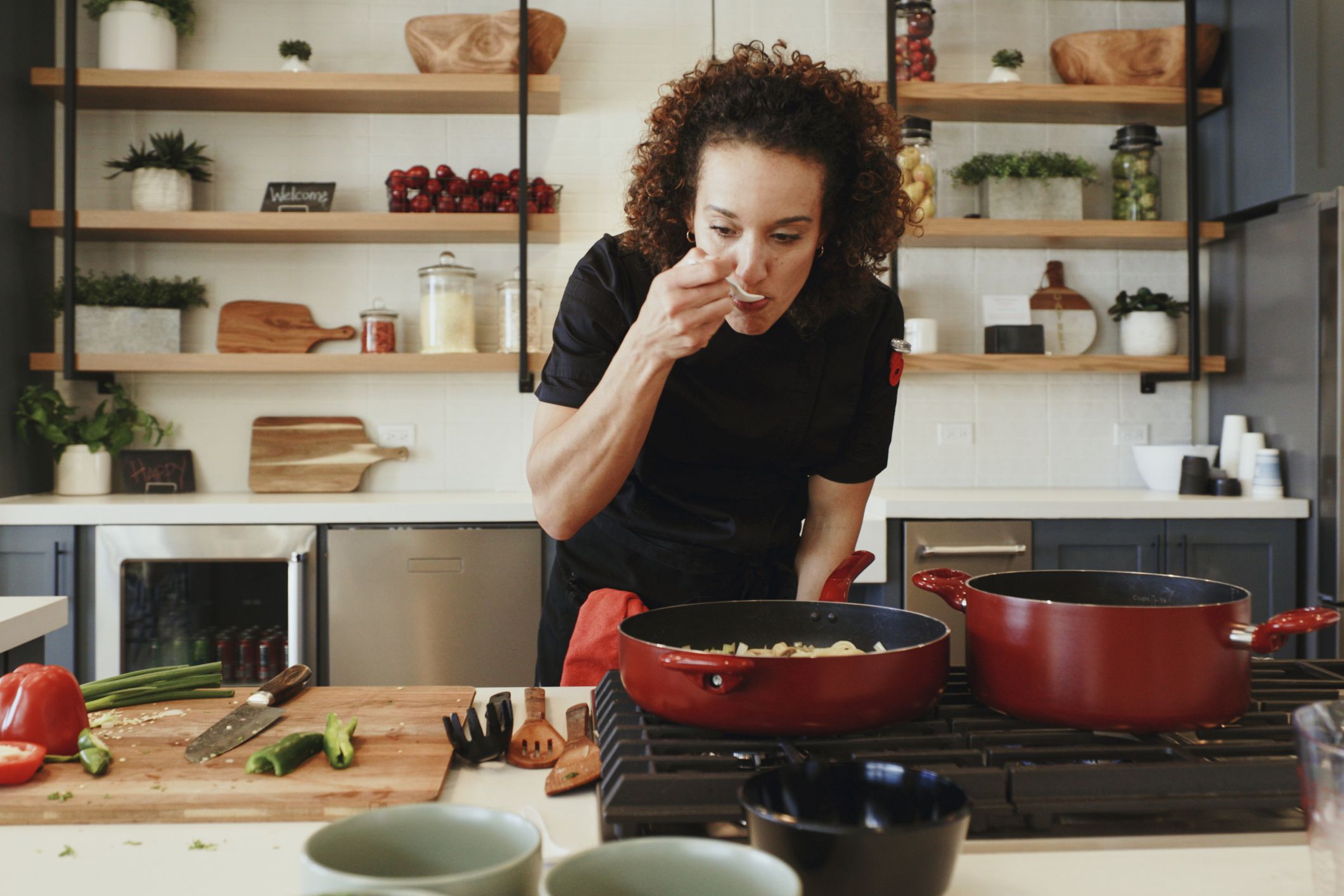 A professional woman chef at work in a modern kitchen.