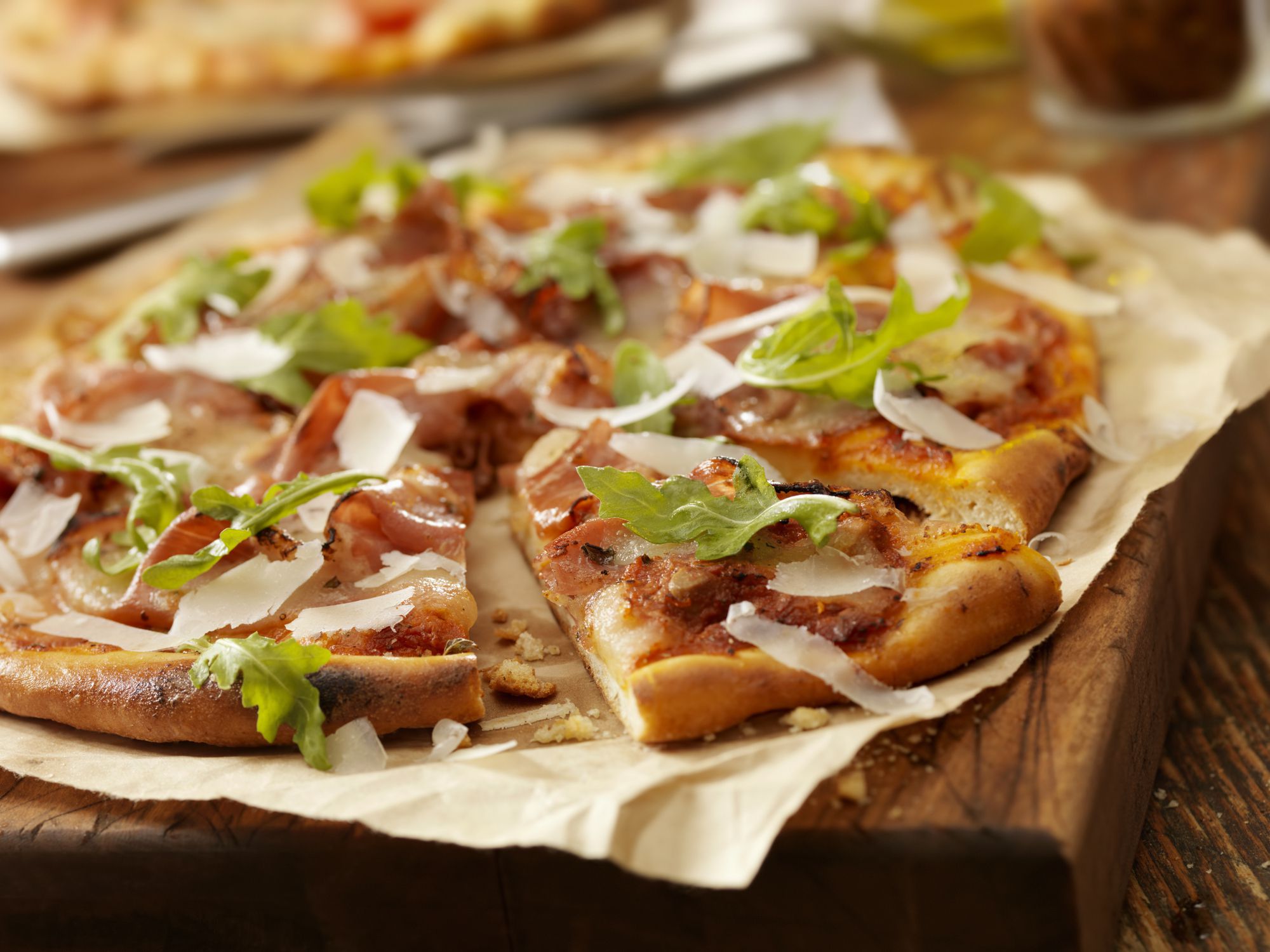 Authentic Italian, Hand Made Prosciutto and Arugula Pizza with Fresh Parmesean Cheese - Photographed on a Hasselblad H3D11-39 megapixel Camera System