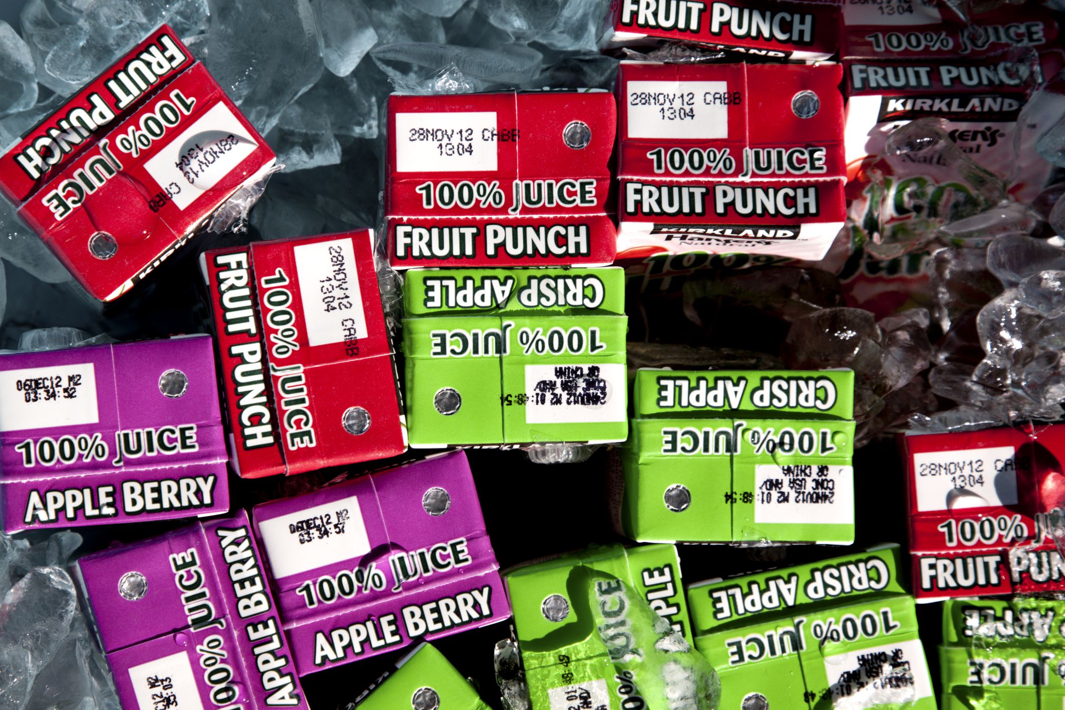 Chula Vista,USA- October 31, 2011: Kirkland juice boxes on ice. Kirkland is the Costco store brand. The juice boxes come in three flavors, crisp apple juice, berry apple juice and fruit punch.