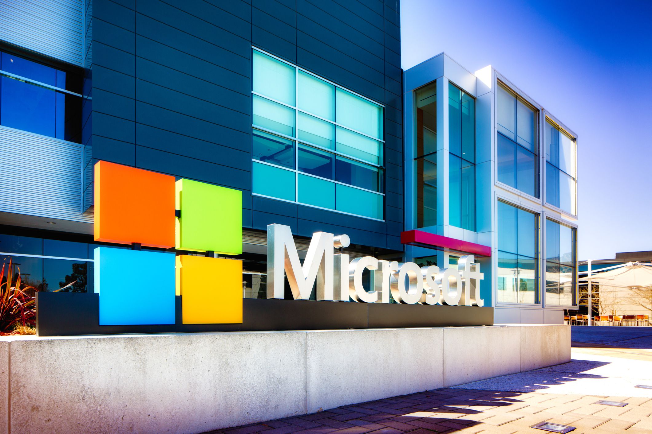 Microsoft sign at the entrance of their Silicon Valley campus in Mountain View, California. One of the main buildings can be seen in the background