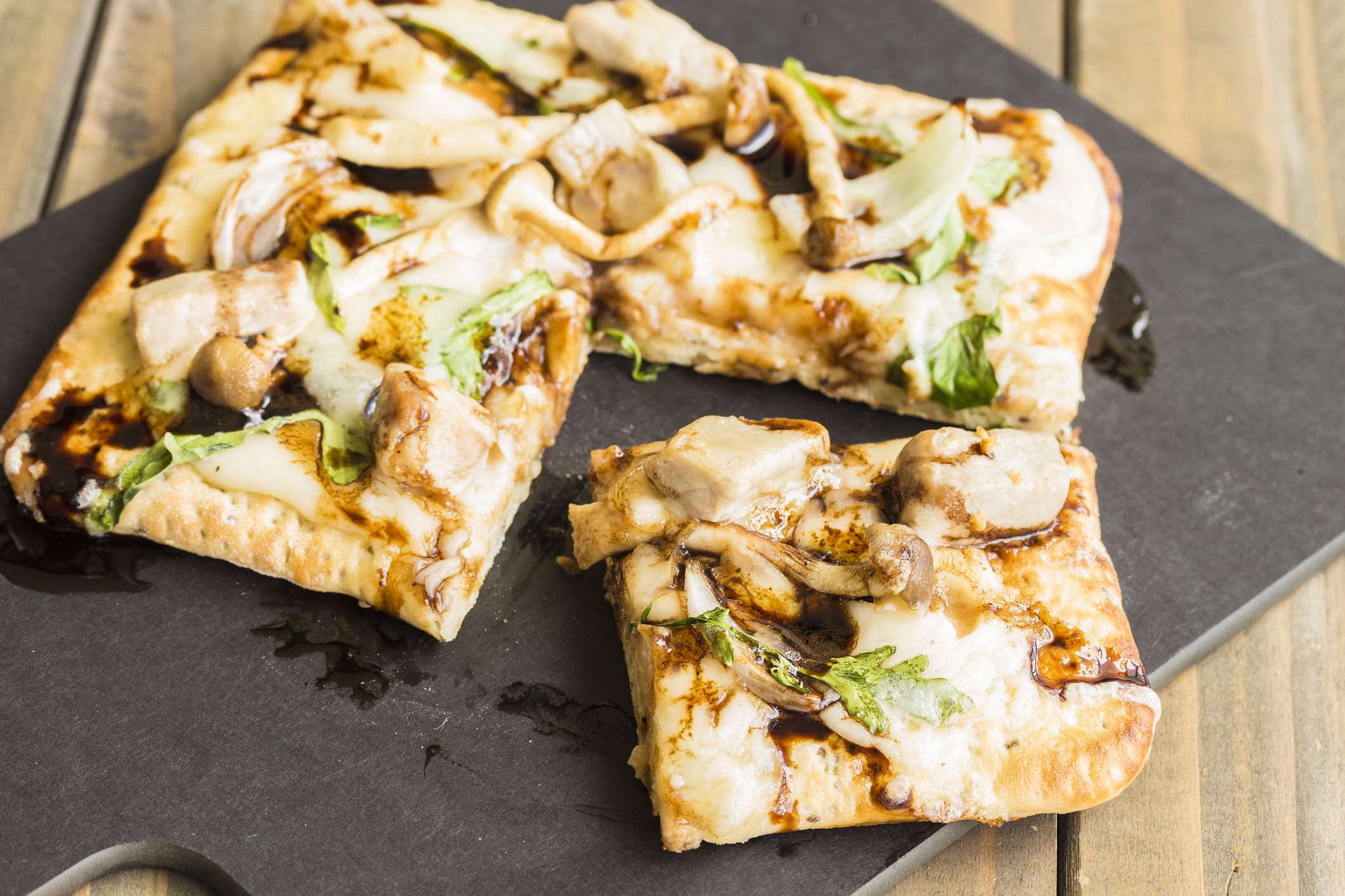 Chia flatbread topped with creamy bechamel sauce, arugula, smoked havarti cheese, sauteed hamakua mushrooms, sweet Maui onion and smoked Ahi tuna, drizzled with balsamic reduction