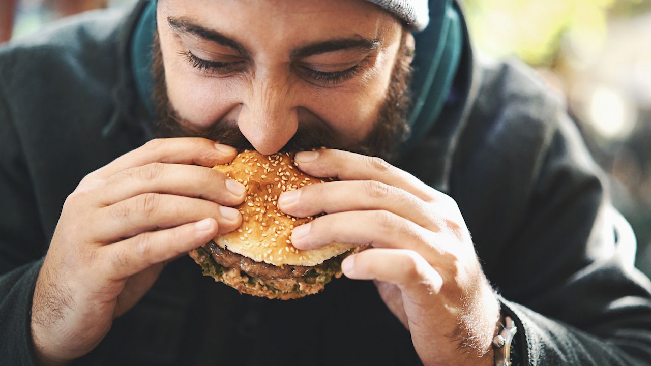 Man Eating Burger