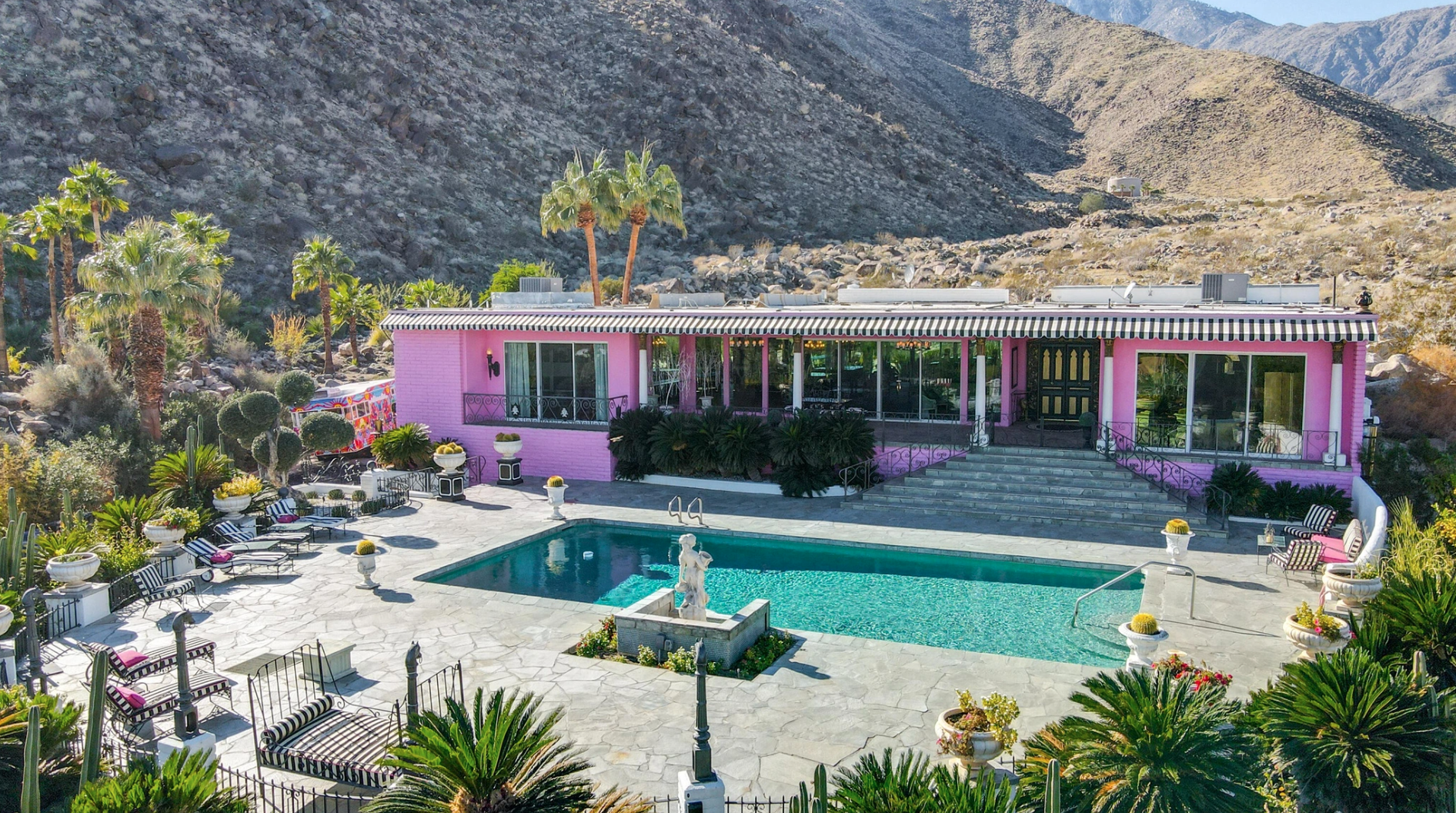 exterior of pink, mid-century style single-story home