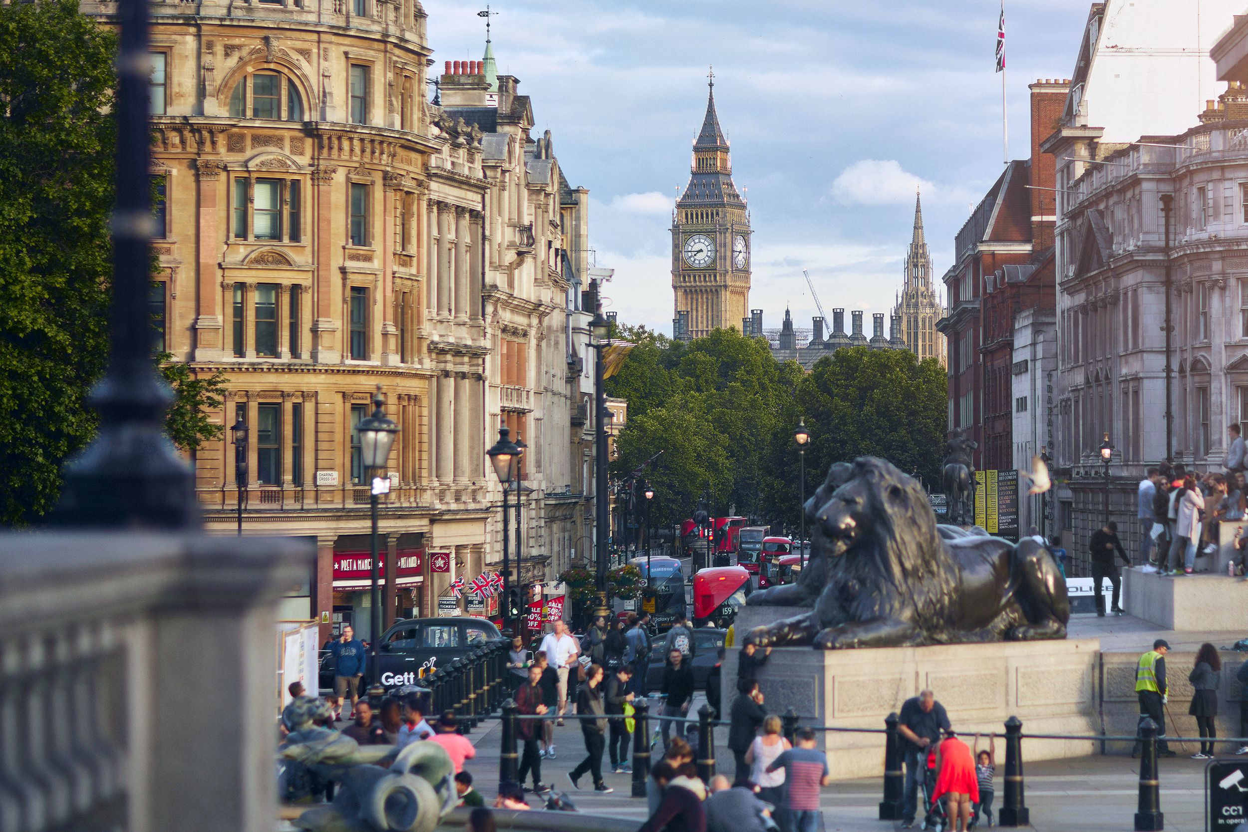 people visiting Trafalgar Square in London with the Big Ben in the background