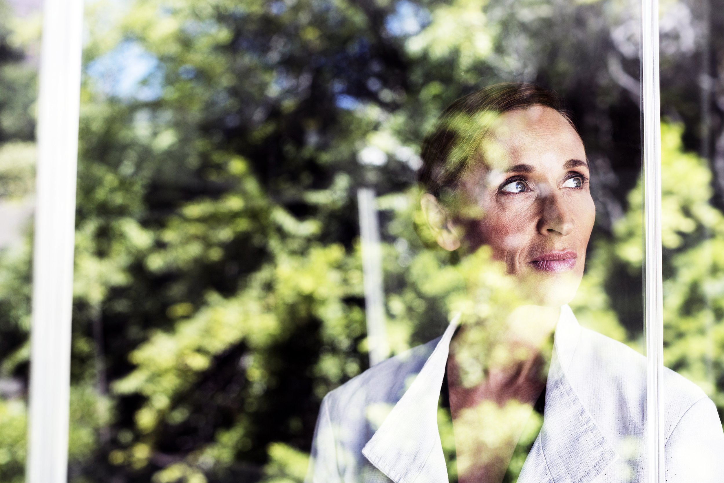 Woman looking out window
