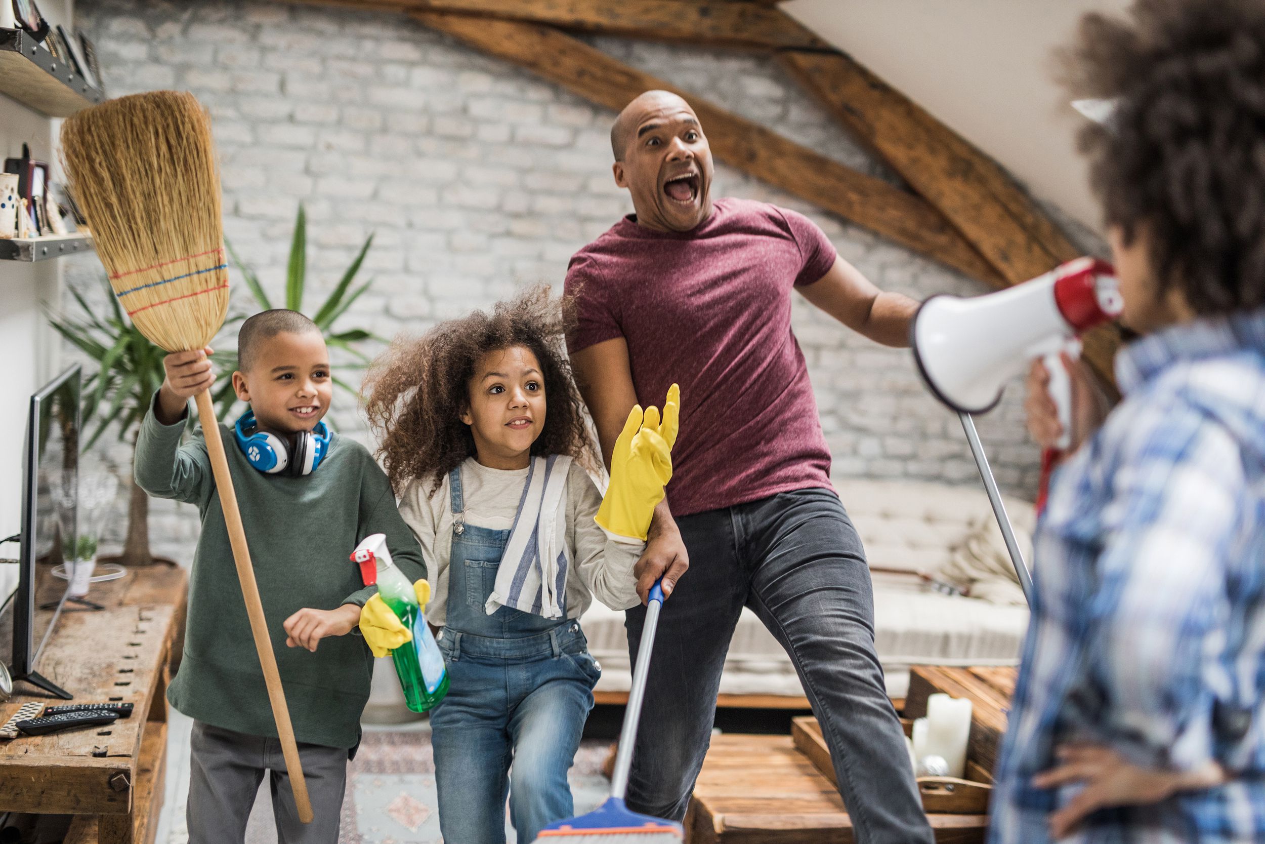 family having fun while cleaning