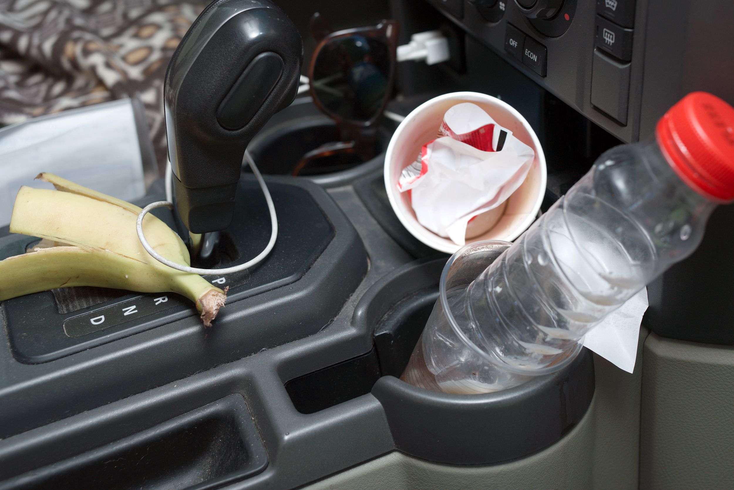 mess in car front area, cup holder