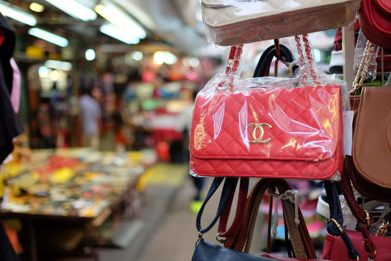 Fake Chanel bag wrapped in plastic in an outdoor market