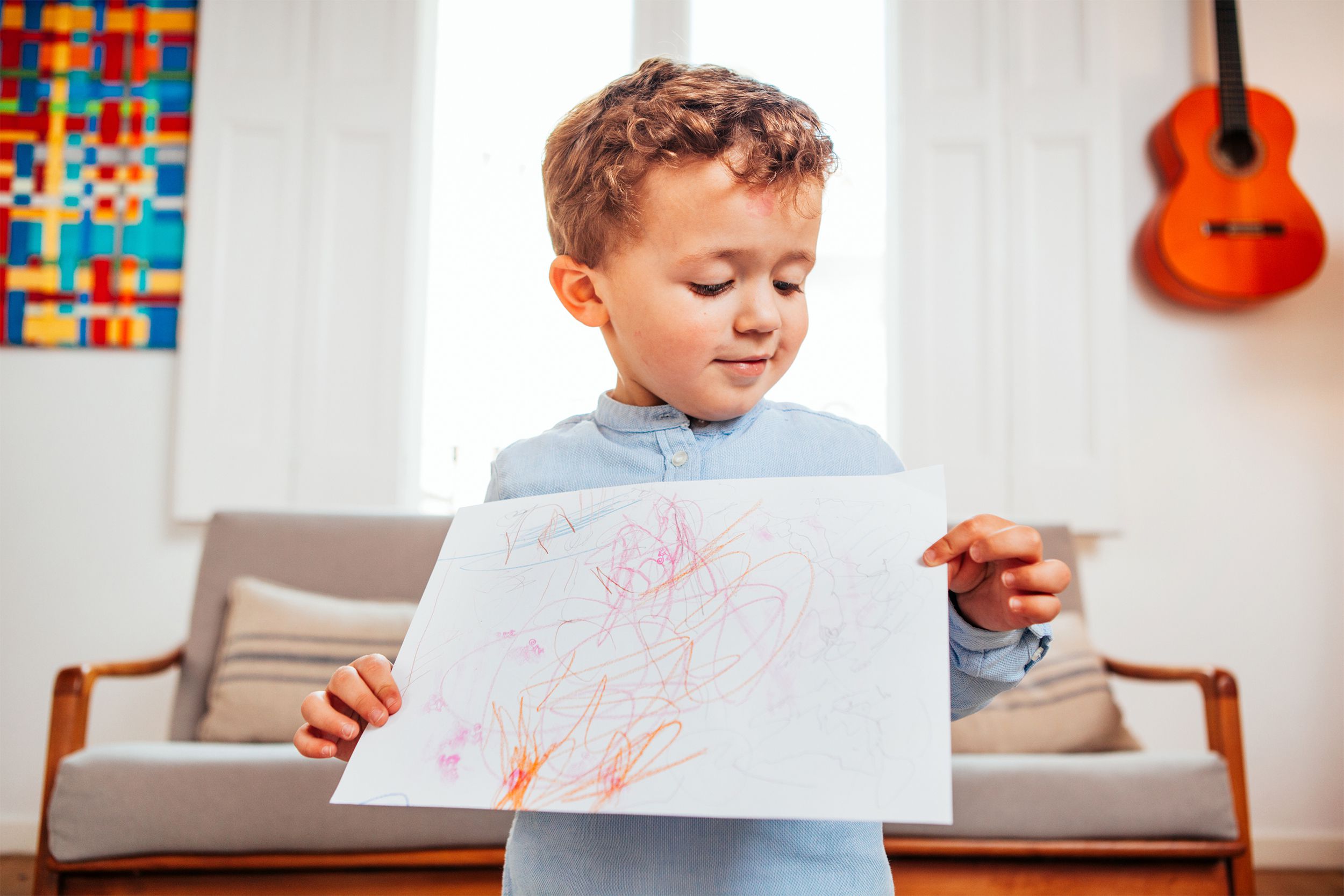 Child holding a drawing