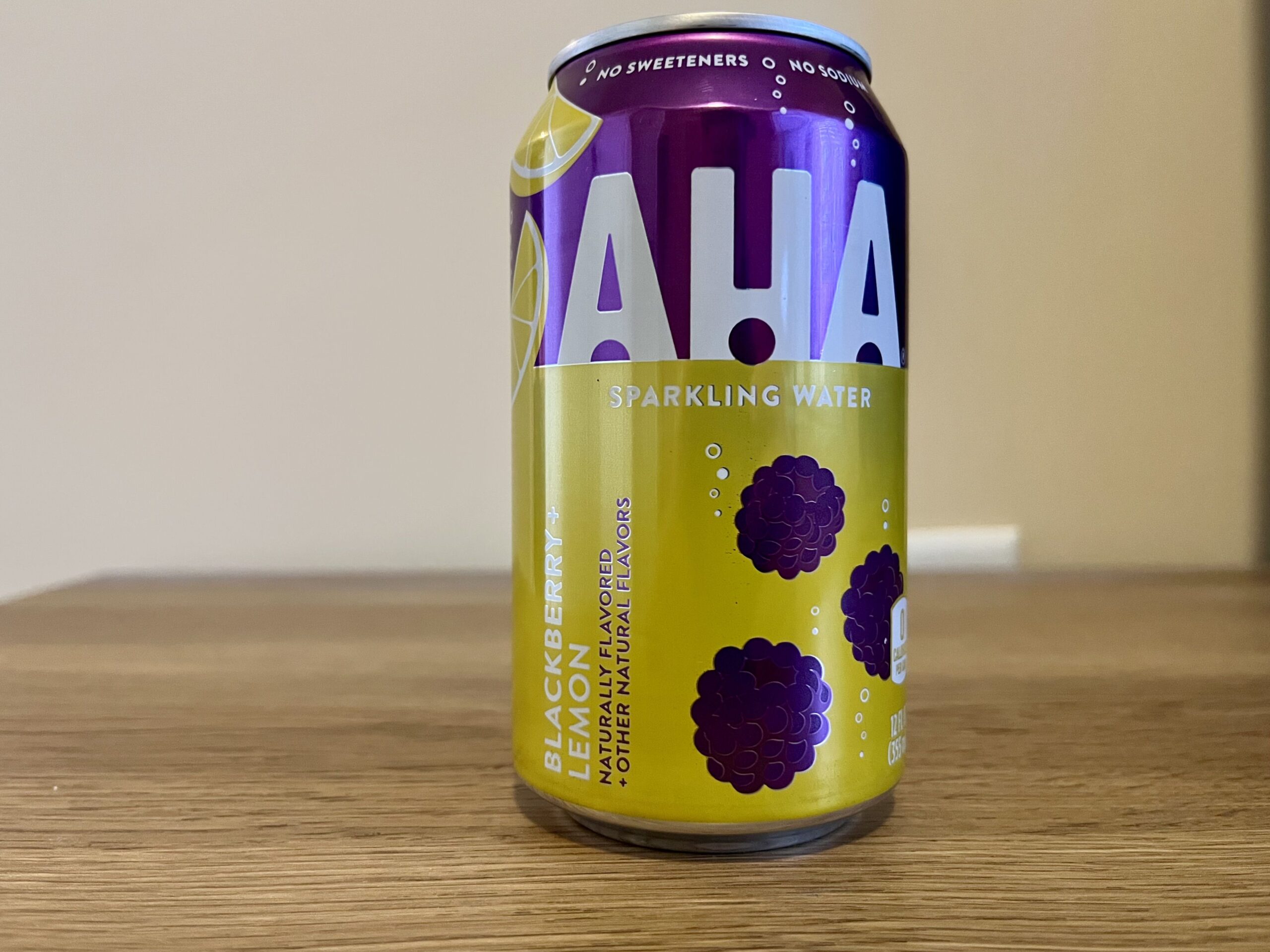a can of blackberry lemon aha sparkling water