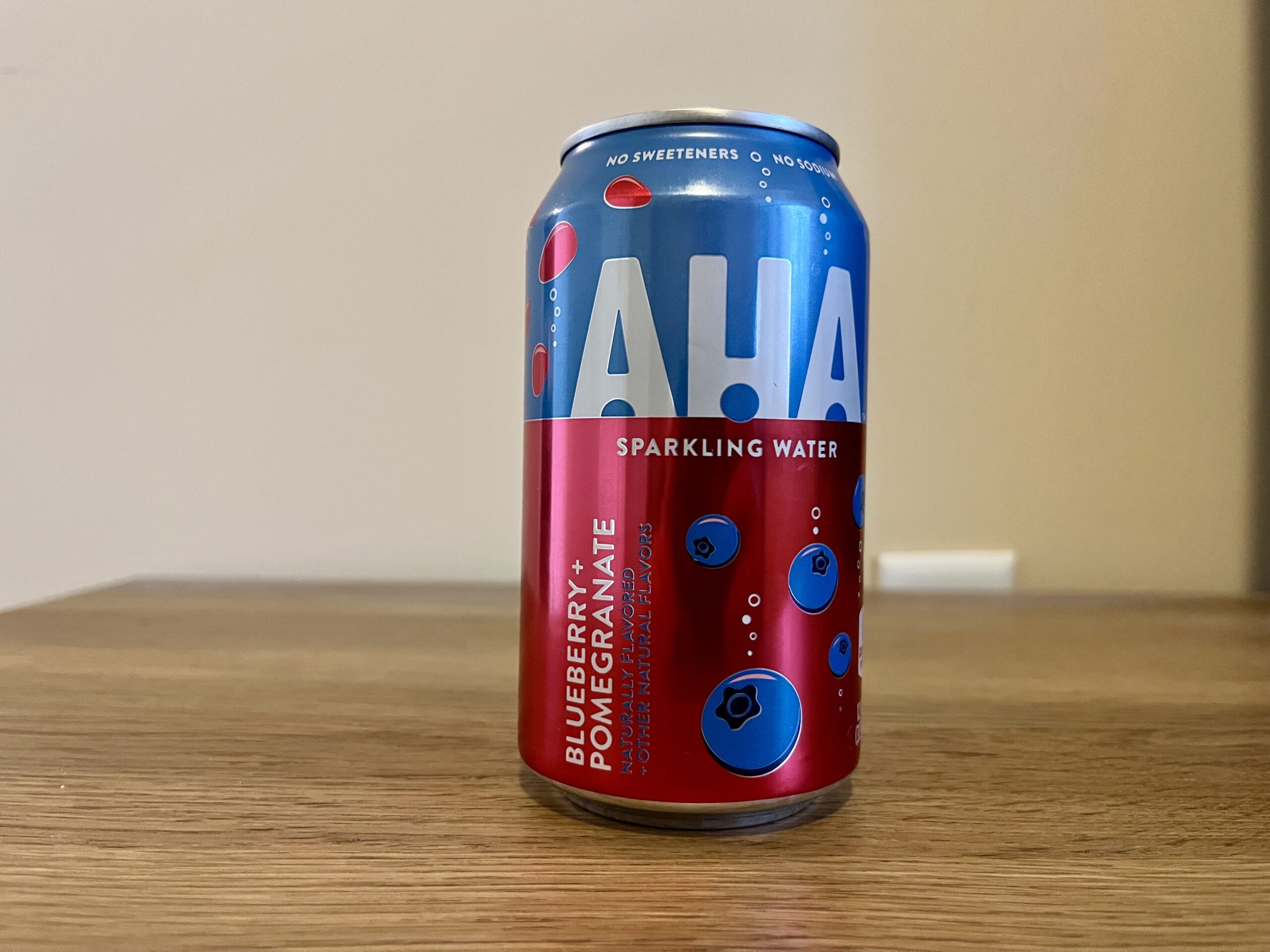 a can of blueberry pomegranate aha sparkling water