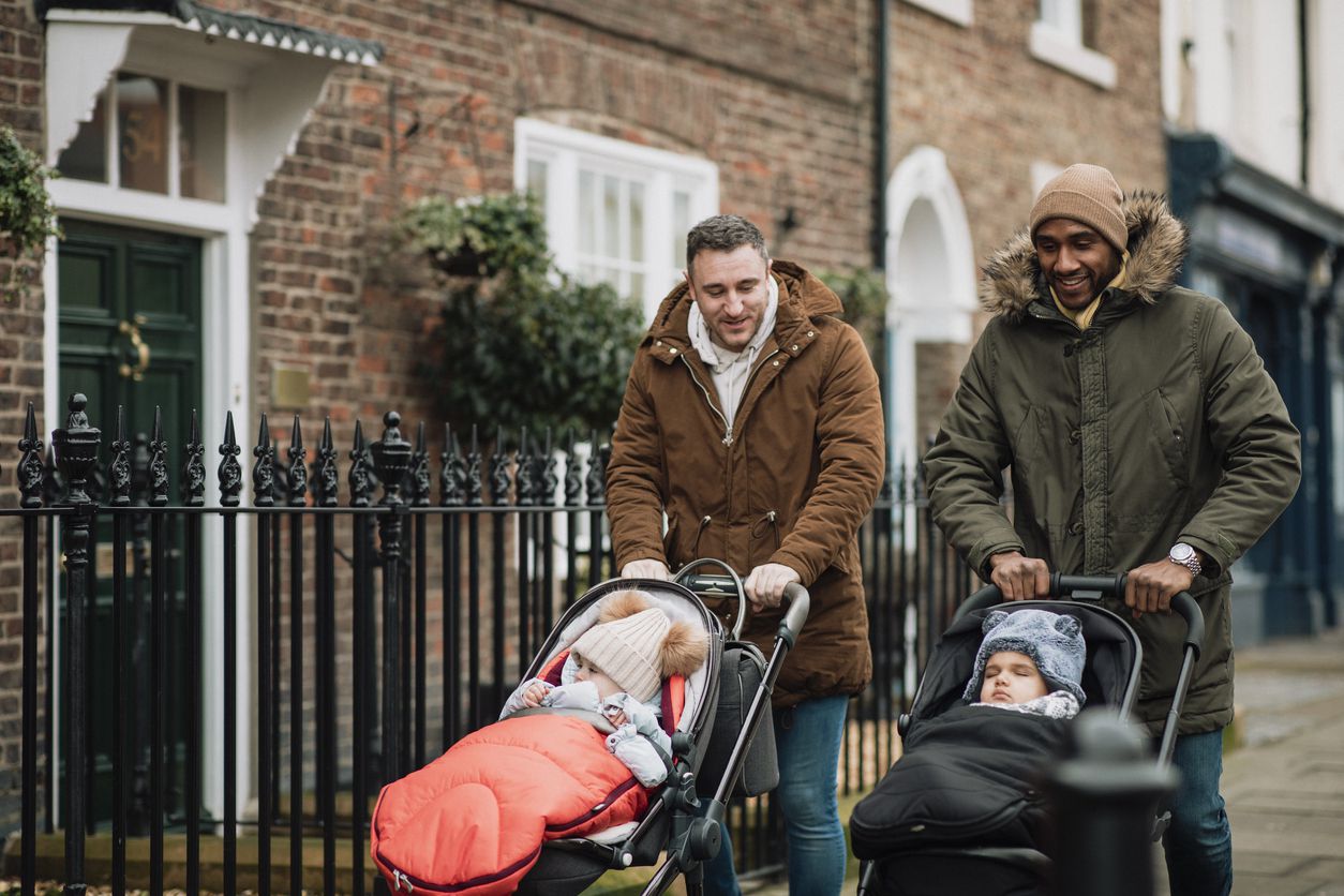 men pushing strollers