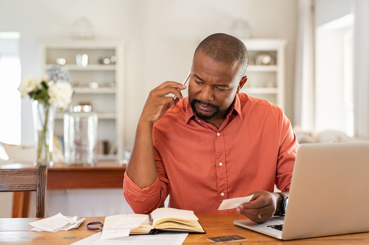 man calling credit card company
