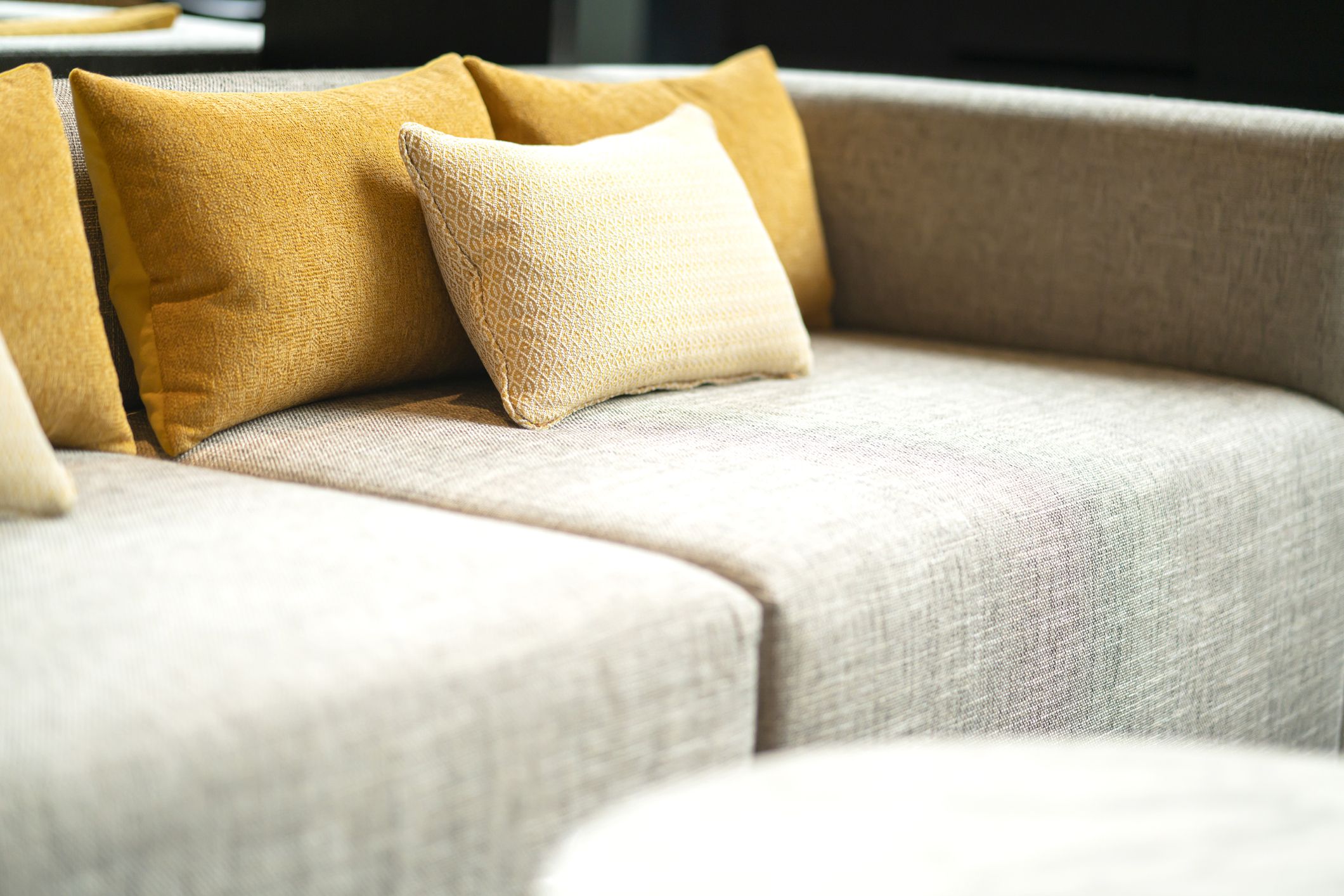close up soft pillow cushion attange on sofa at garden patio hotel area furniture design ideas concept