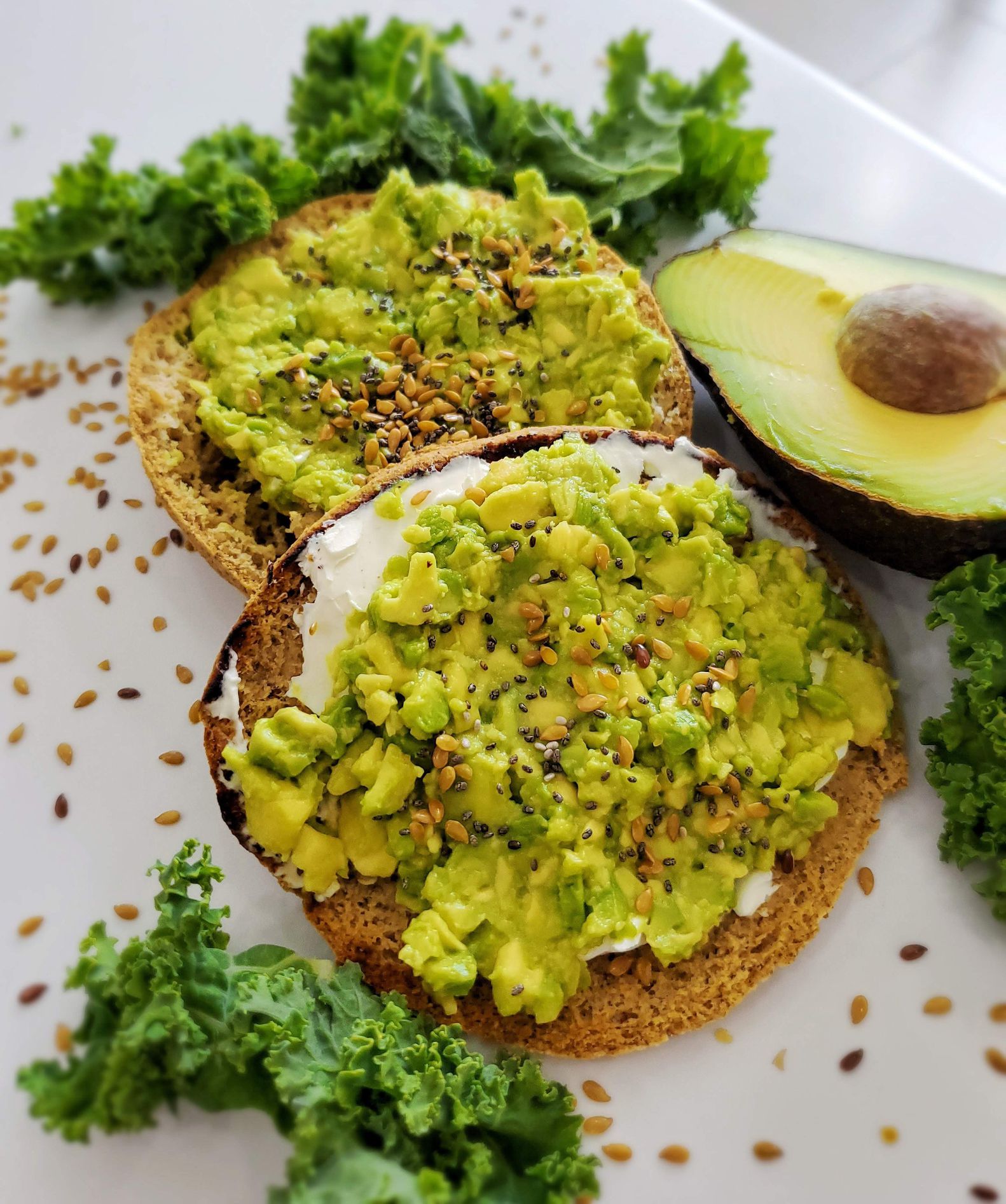 Keto avocado bagel made with cream cheese, seasoned avocado.