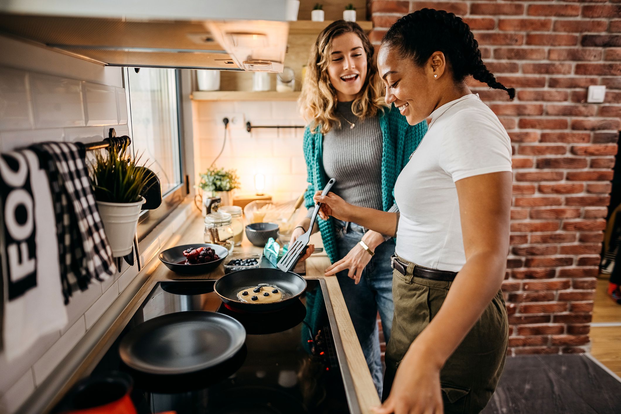 Close up of a young couple making breakfast at home