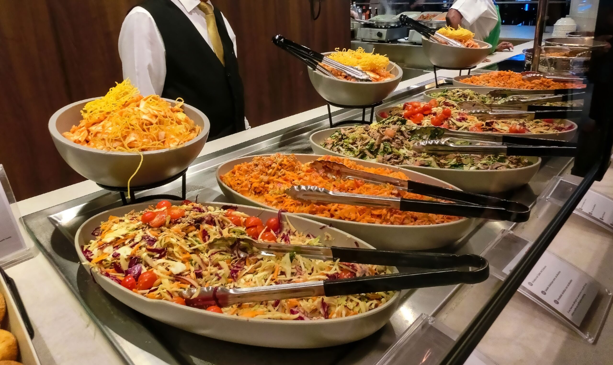 Dining Room Buffet aboard the abstract luxury cruise ship. Selective focus. vegetable dishes
