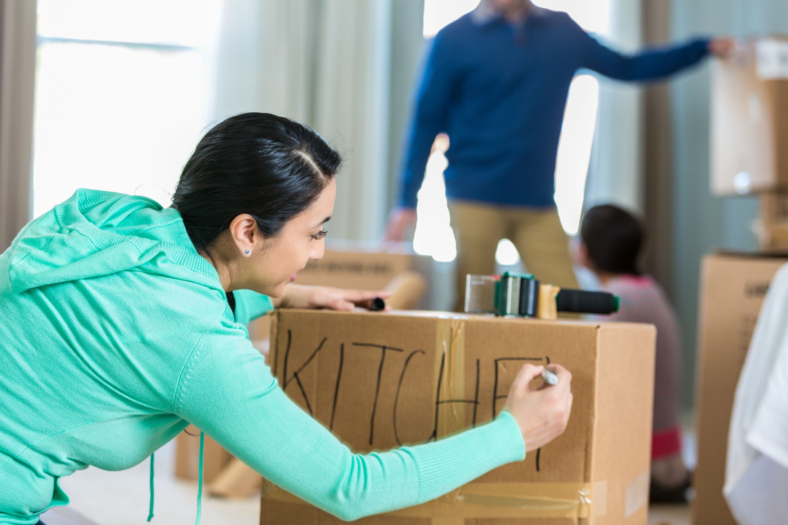 woman labeling box