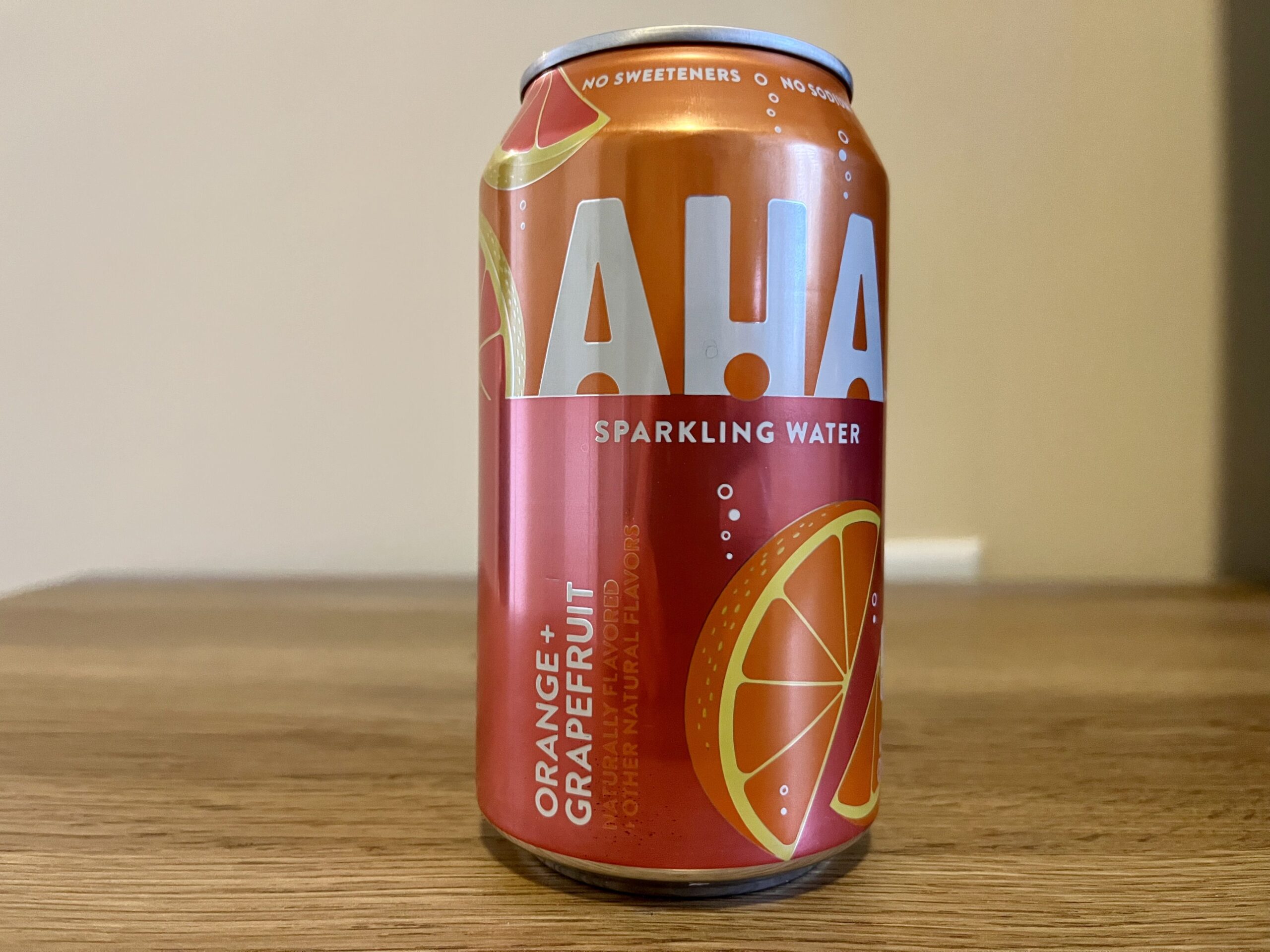 a can of orange grapefruit aha sparkling water