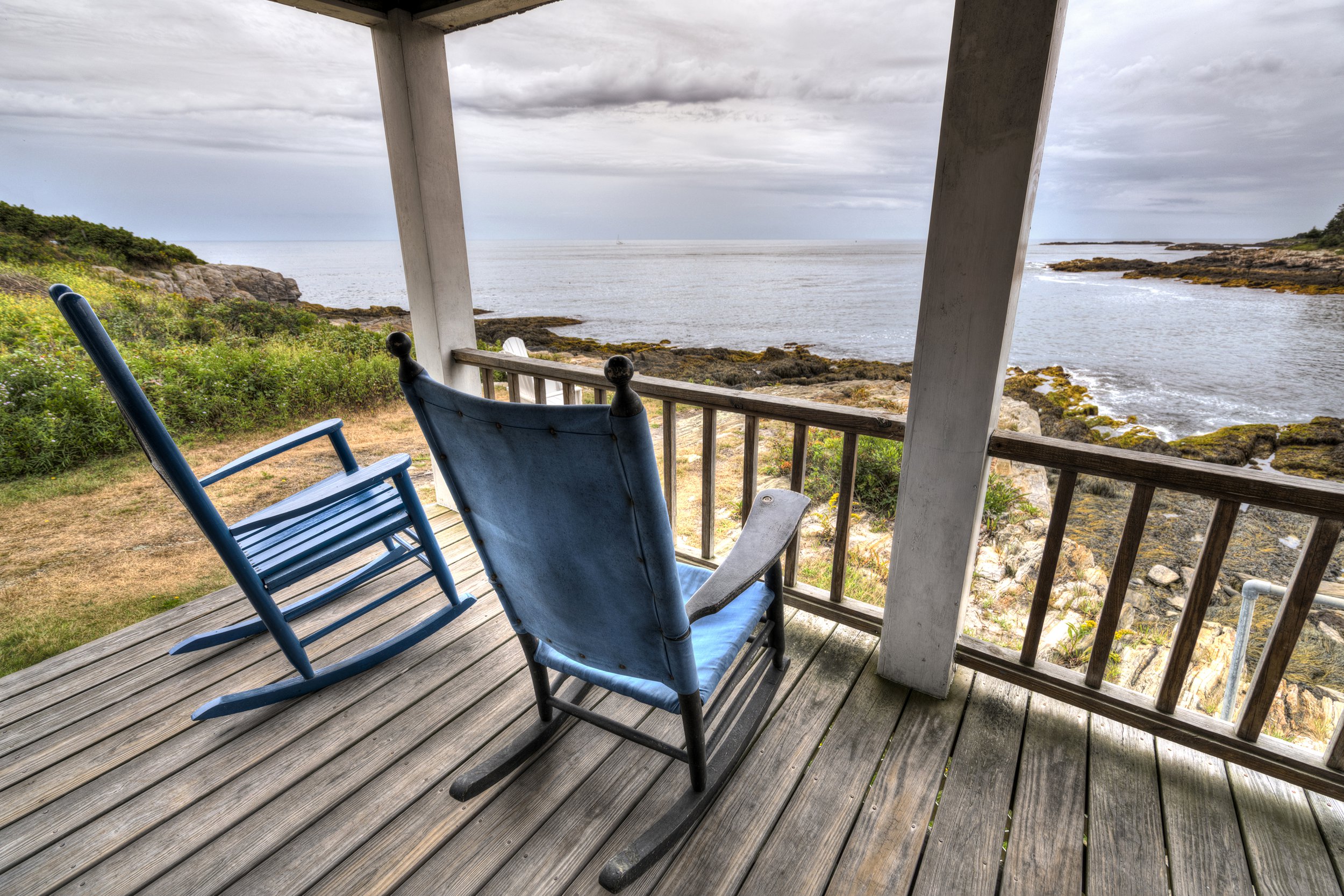 View of front porch of a secluded cabin on the beach