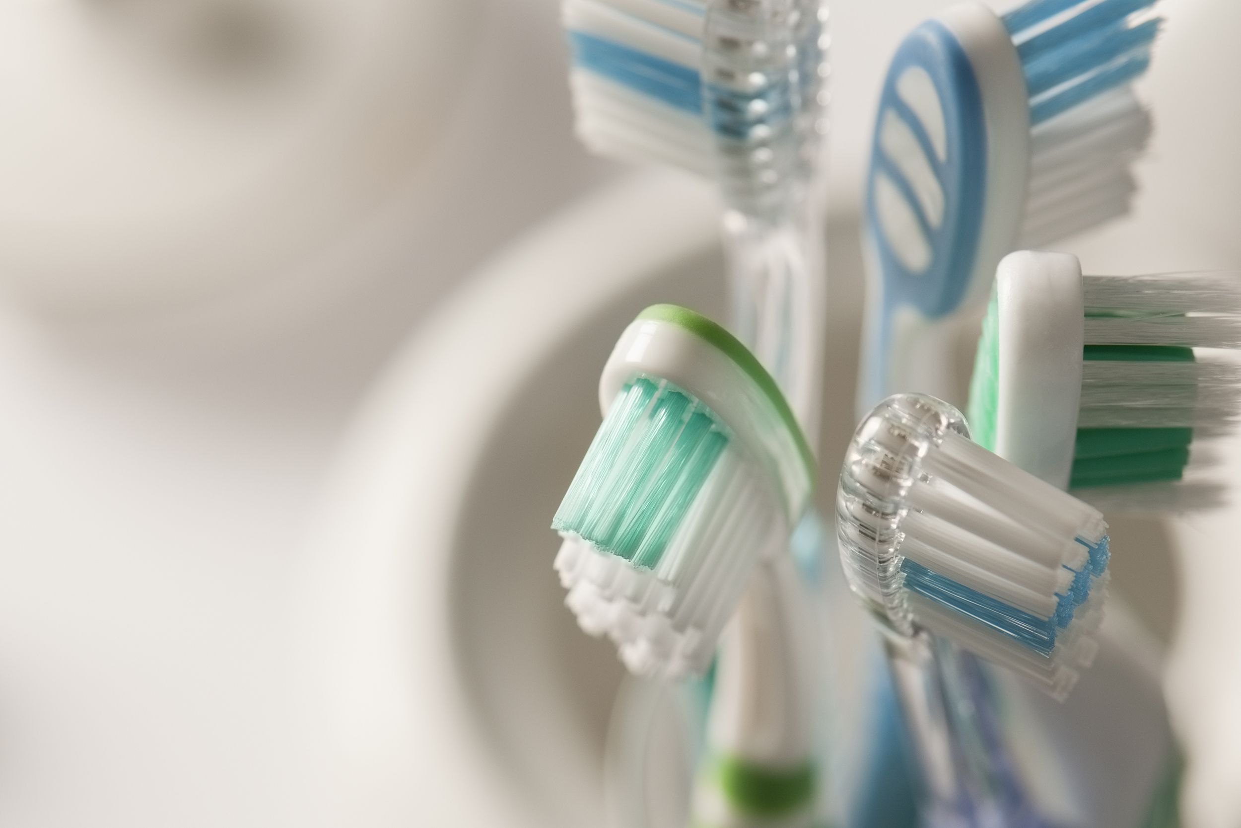 toothbrushes standing in a toothbrush holder