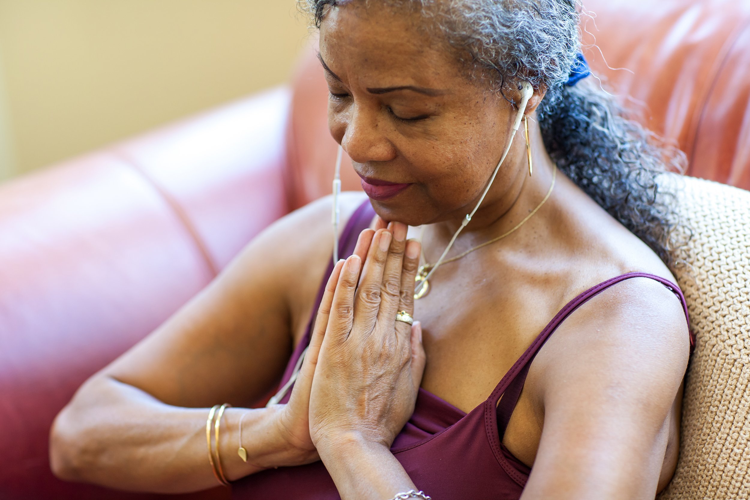 senior woman meditating at home