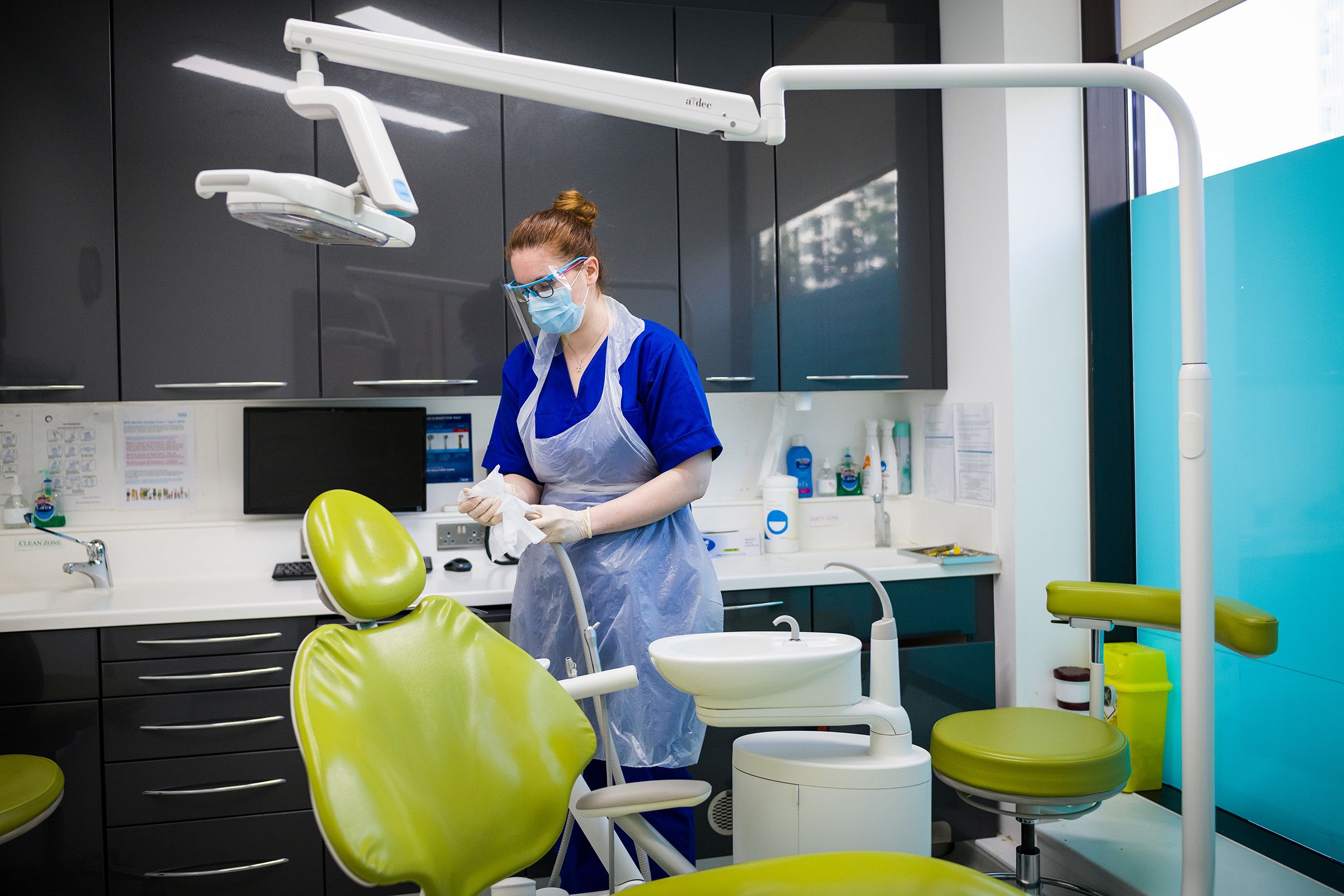 Dental Nurse Johanna Bartha disinfects one of the six surgery rooms at East Village dental practice following a procedure with a patient on May 28, 2020