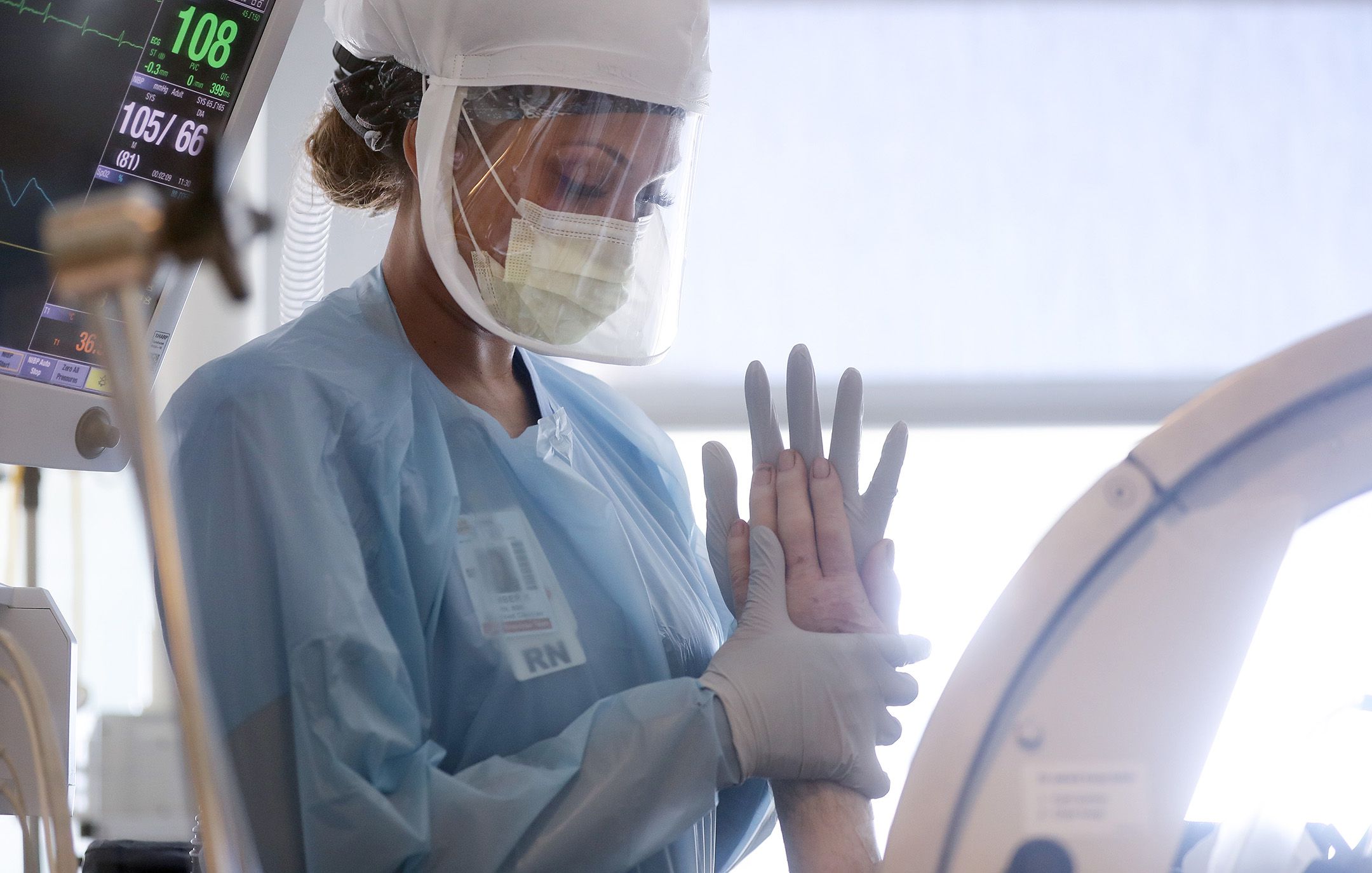 Nurse Amber Kirk wears personal protective equipment (PPE)